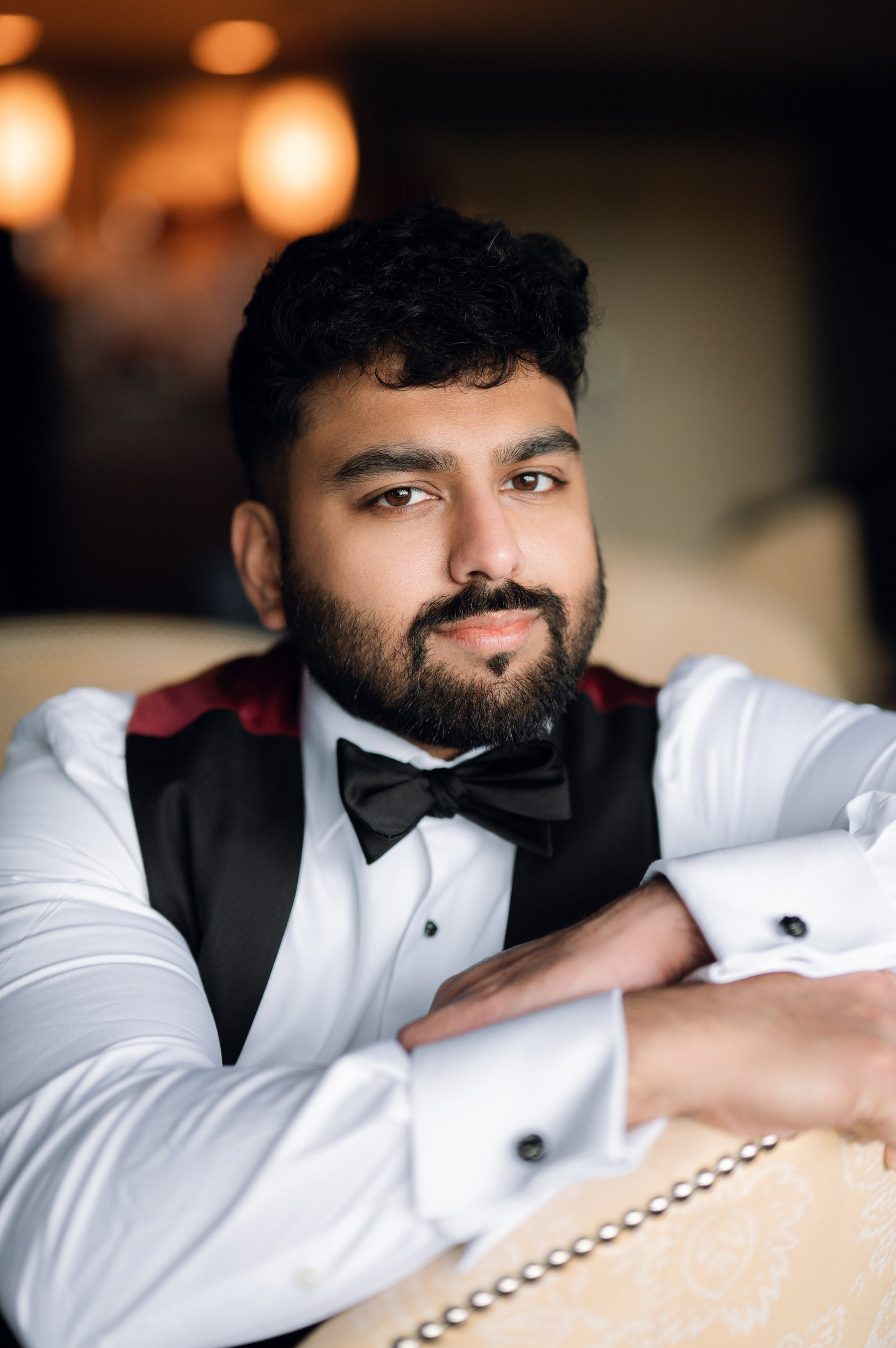 a man in a tuxed shirt and bow tie