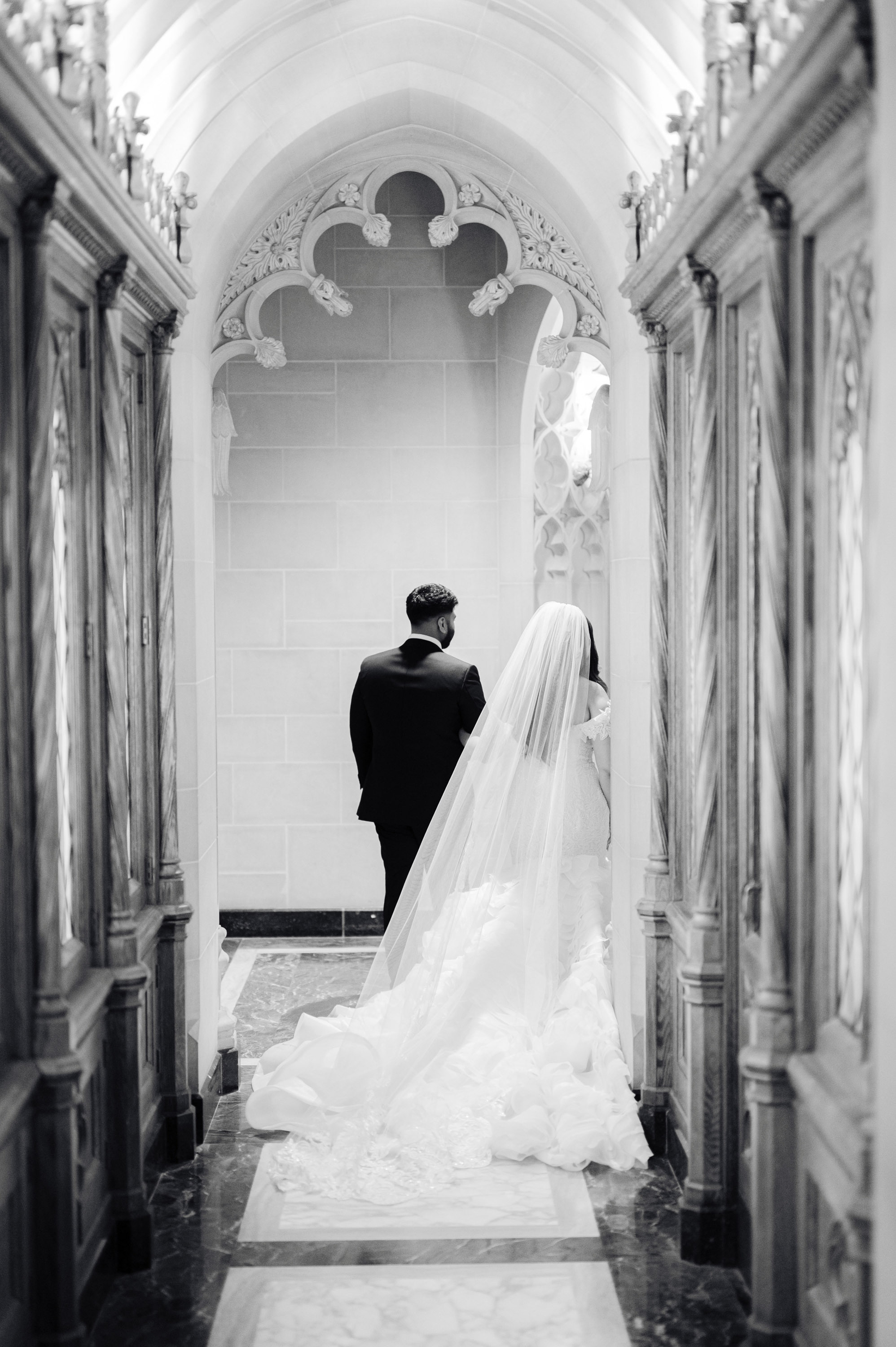 a bride and groom walking down the aisle