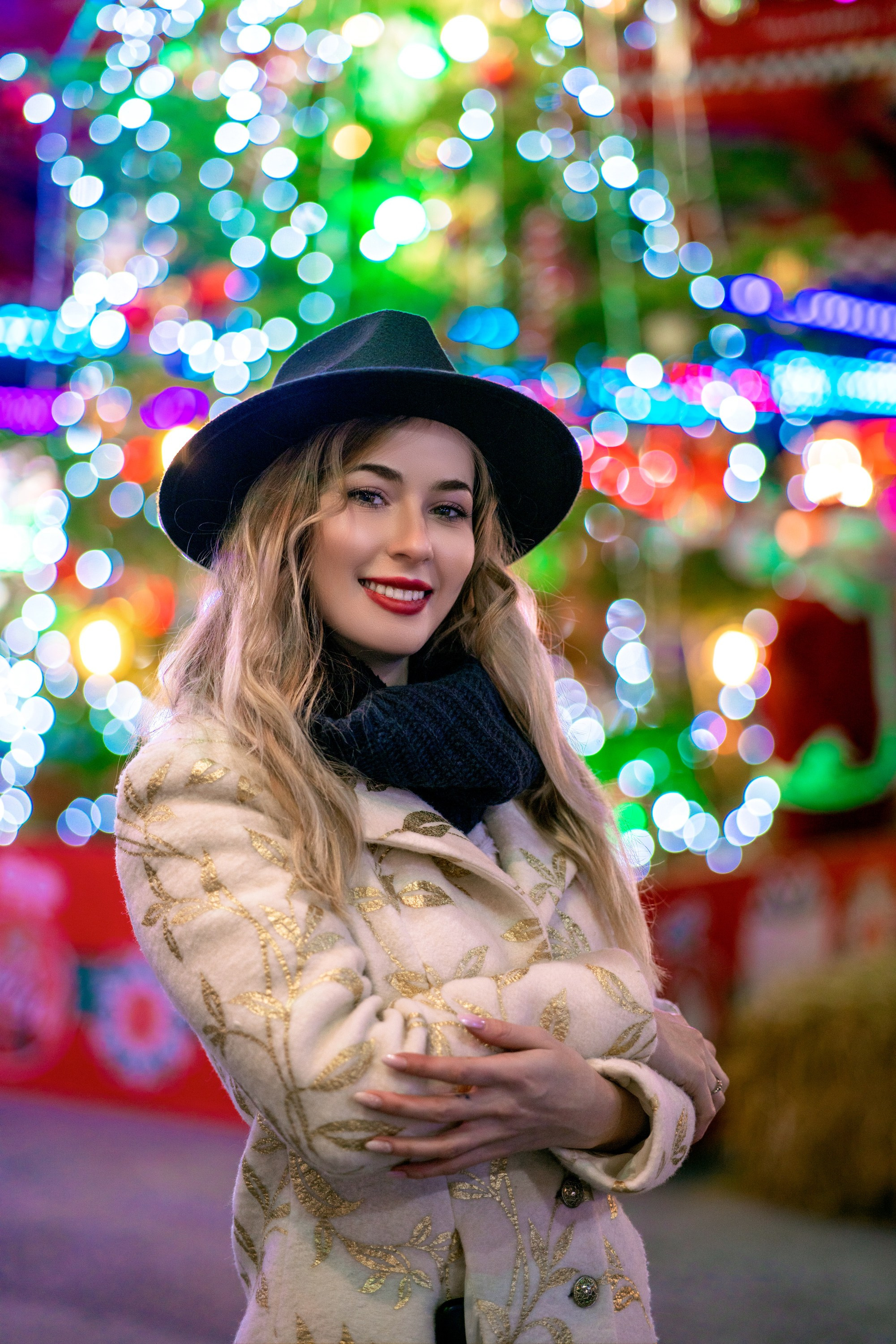 Colorful night portrait of a woman with city lights, urban portrait photography