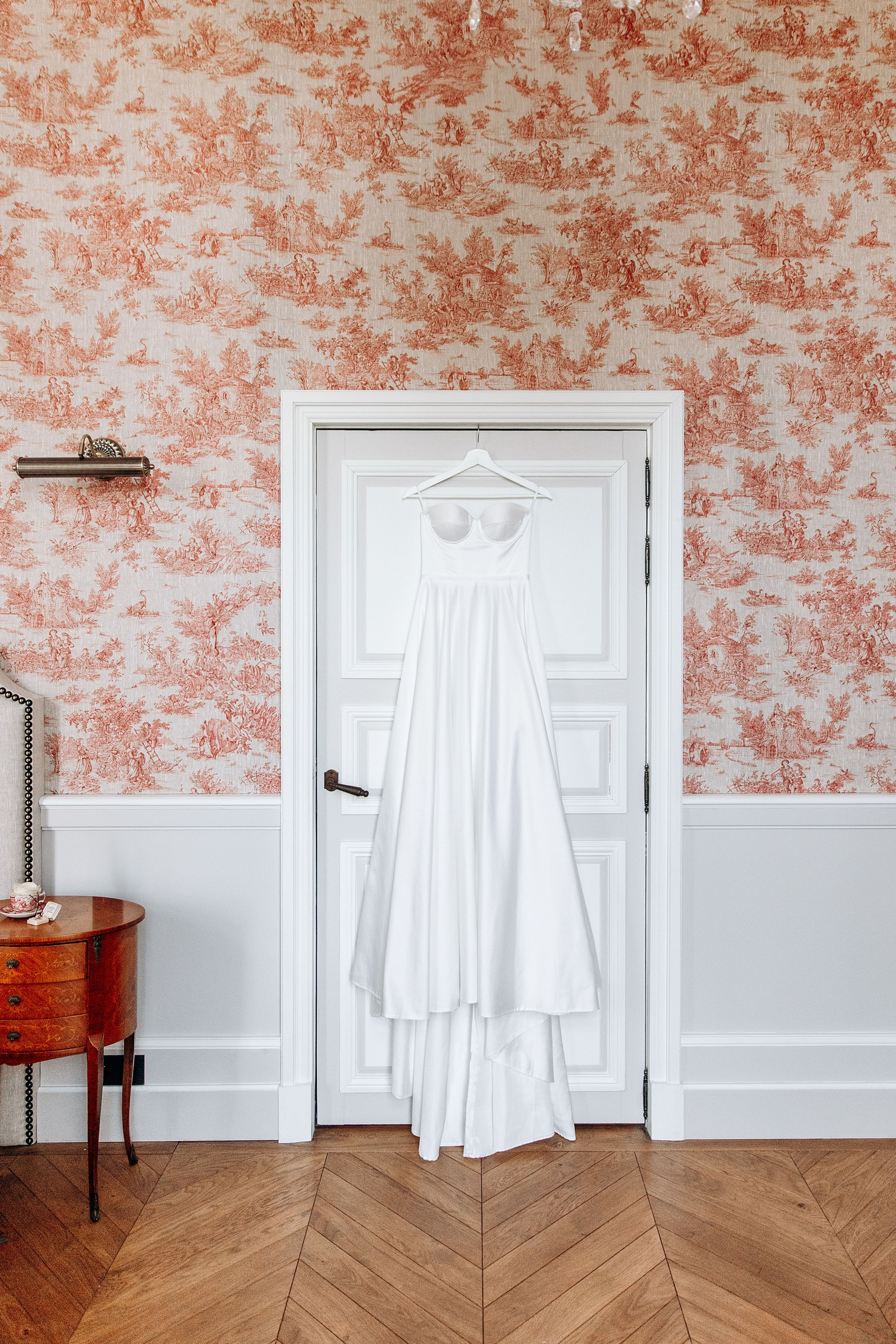 Elegant bridal accessories, including a veil and wedding dress, styled for a destination wedding in France.