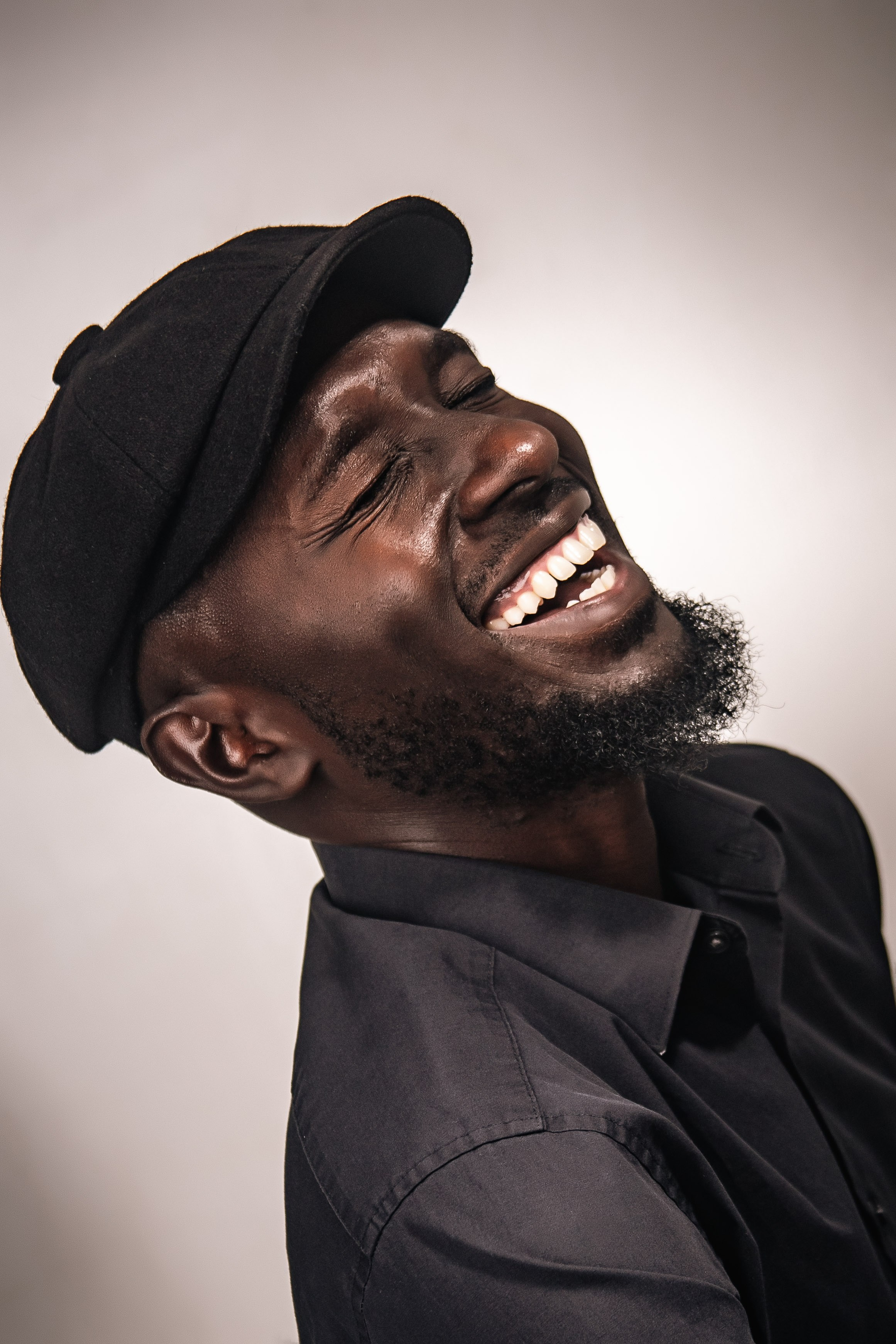 Timeless studio portrait of a joyful man