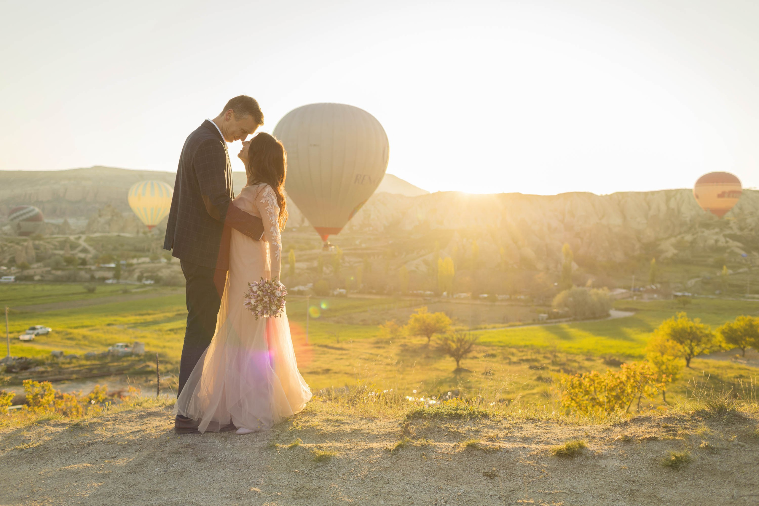 Magical Wedding Photoshoot in Cappadocia: Balloons, Caves, and Valleys. Julia Ganch I Fashion Wedding Photography I Cappadocia Turkey