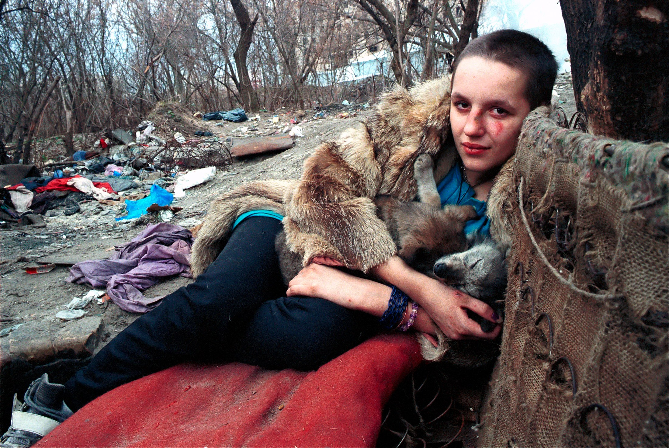 Suffering from a broken nose and bruised ribs Natasha Dzhuley, 16, relaxes after inhaling glue for the first time - something she swore she would never do. She was beaten by her pimp’s men in what Ruslana believes was a warning to other prostitutes to stay in line. Though another child believes her pimp had her beaten because she was pregnant.