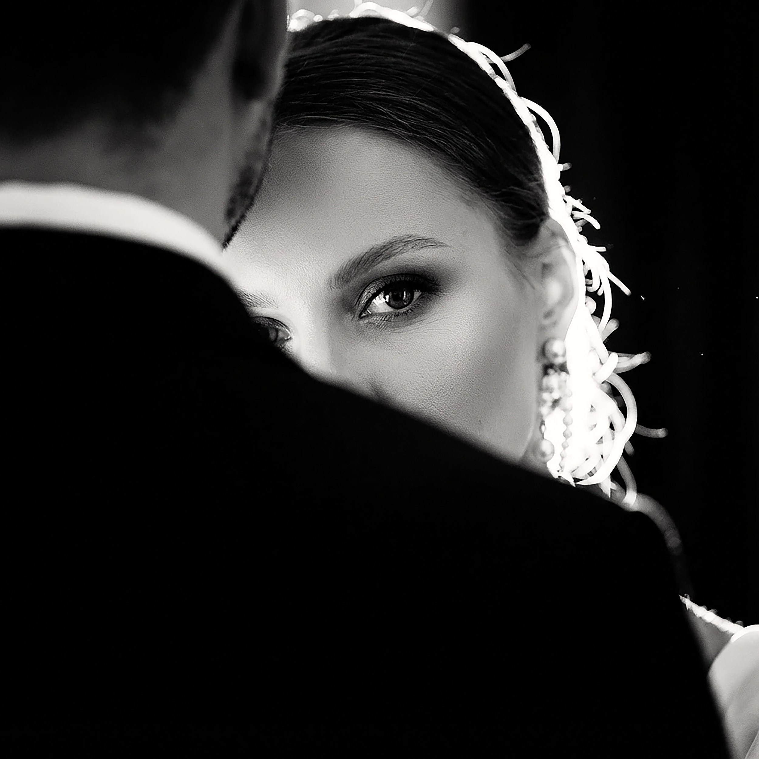 Black and white bridal portrait of bride looking over groom's shoulder by vdphotoart, wedding photographer in Limerick, Ireland.