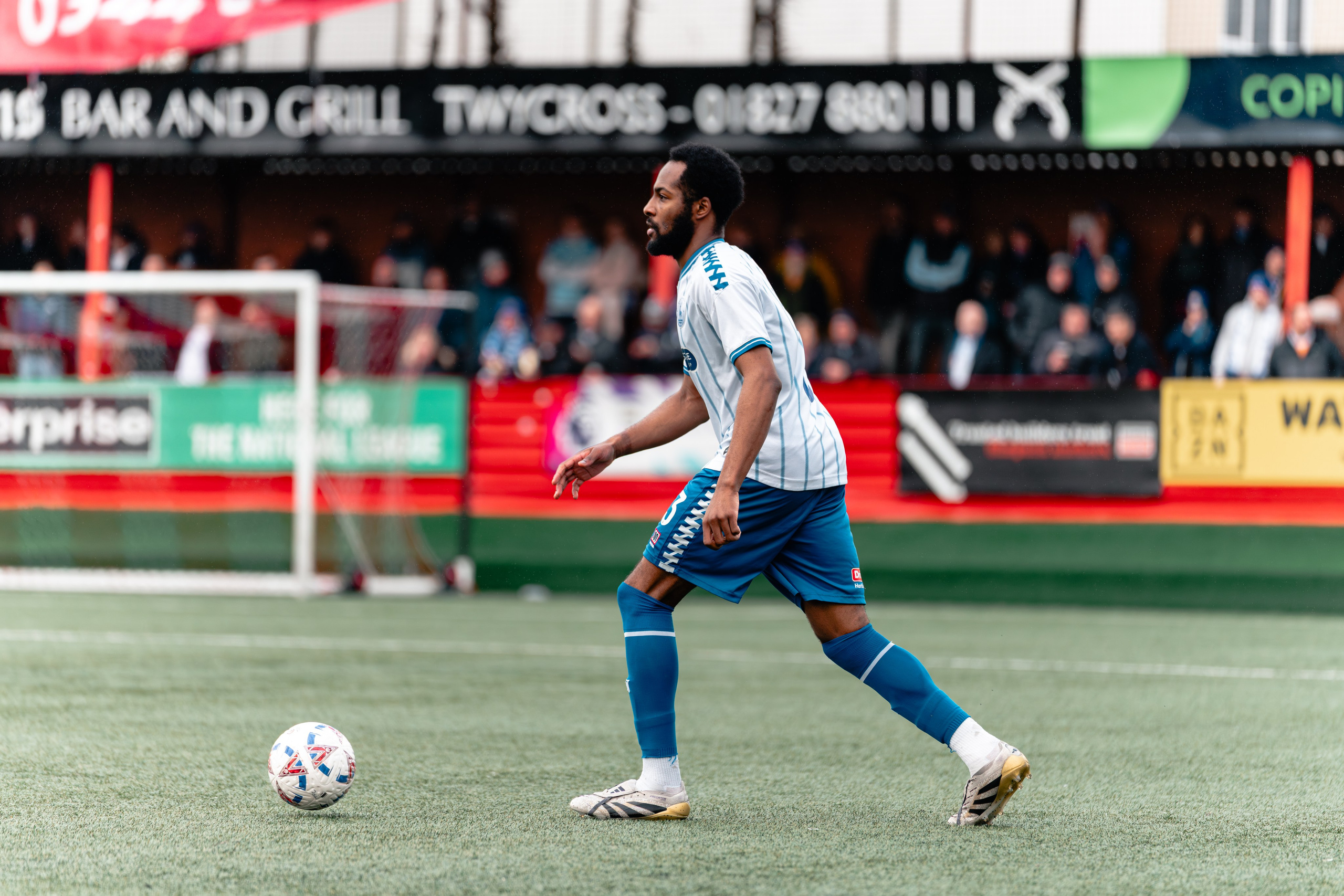 Cameron John of Hartlepool United dribbles forward on the pitch at The Lamb Ground.