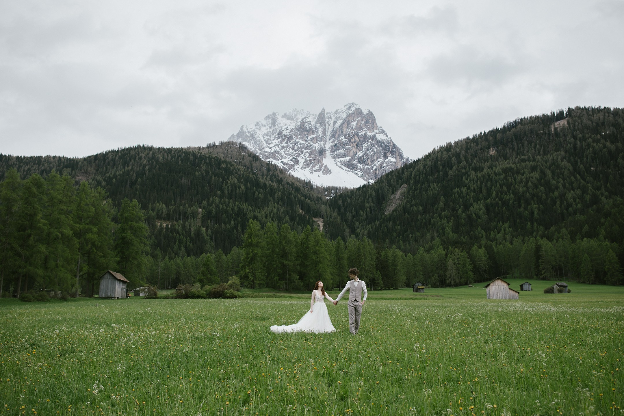 Couple in front of snowy Dolomites