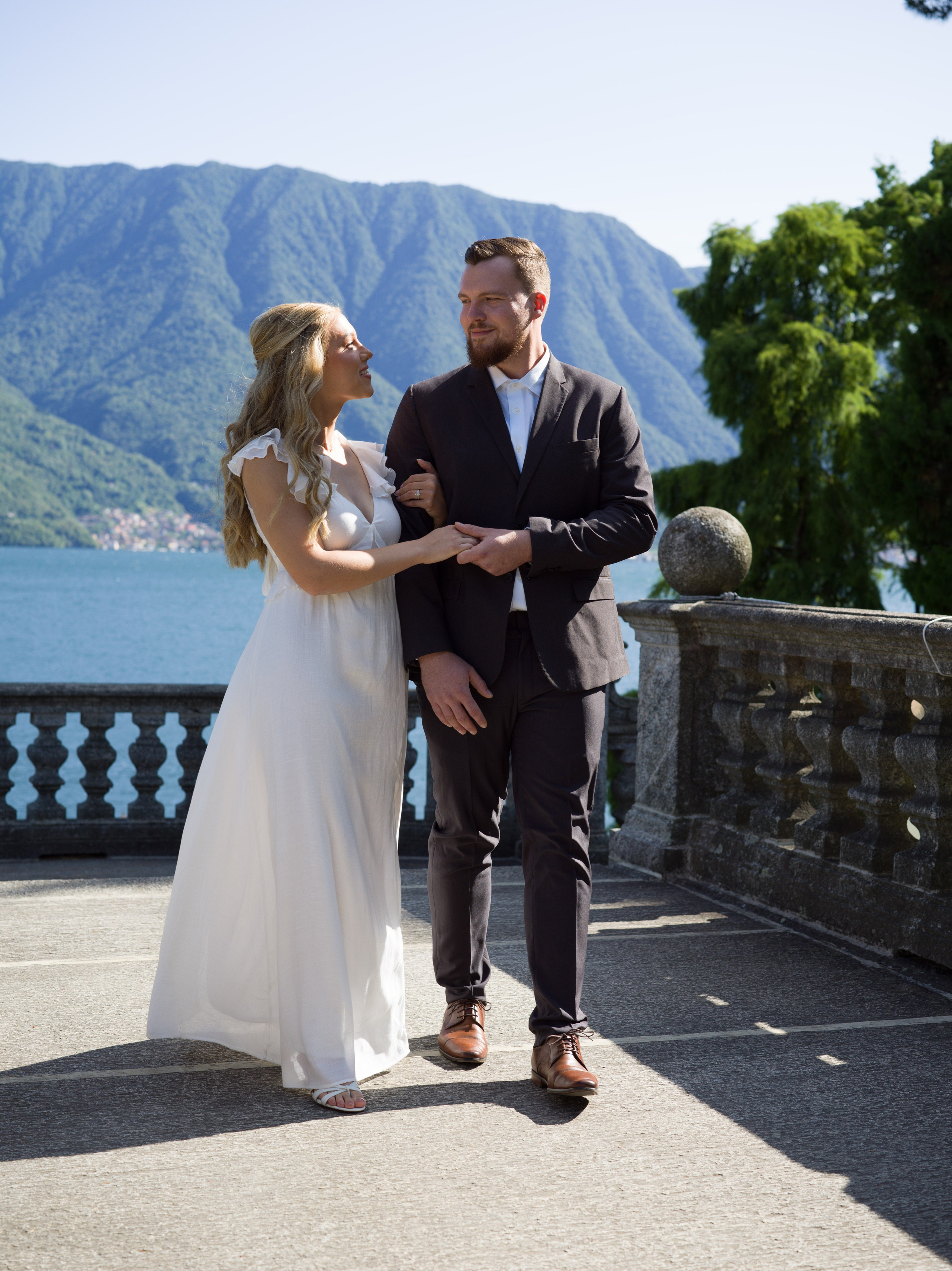 Just-engaged couple celebrating in Parco Civico Teresio Olivelli, Tremezzo, professional Lake Como proposal photographer