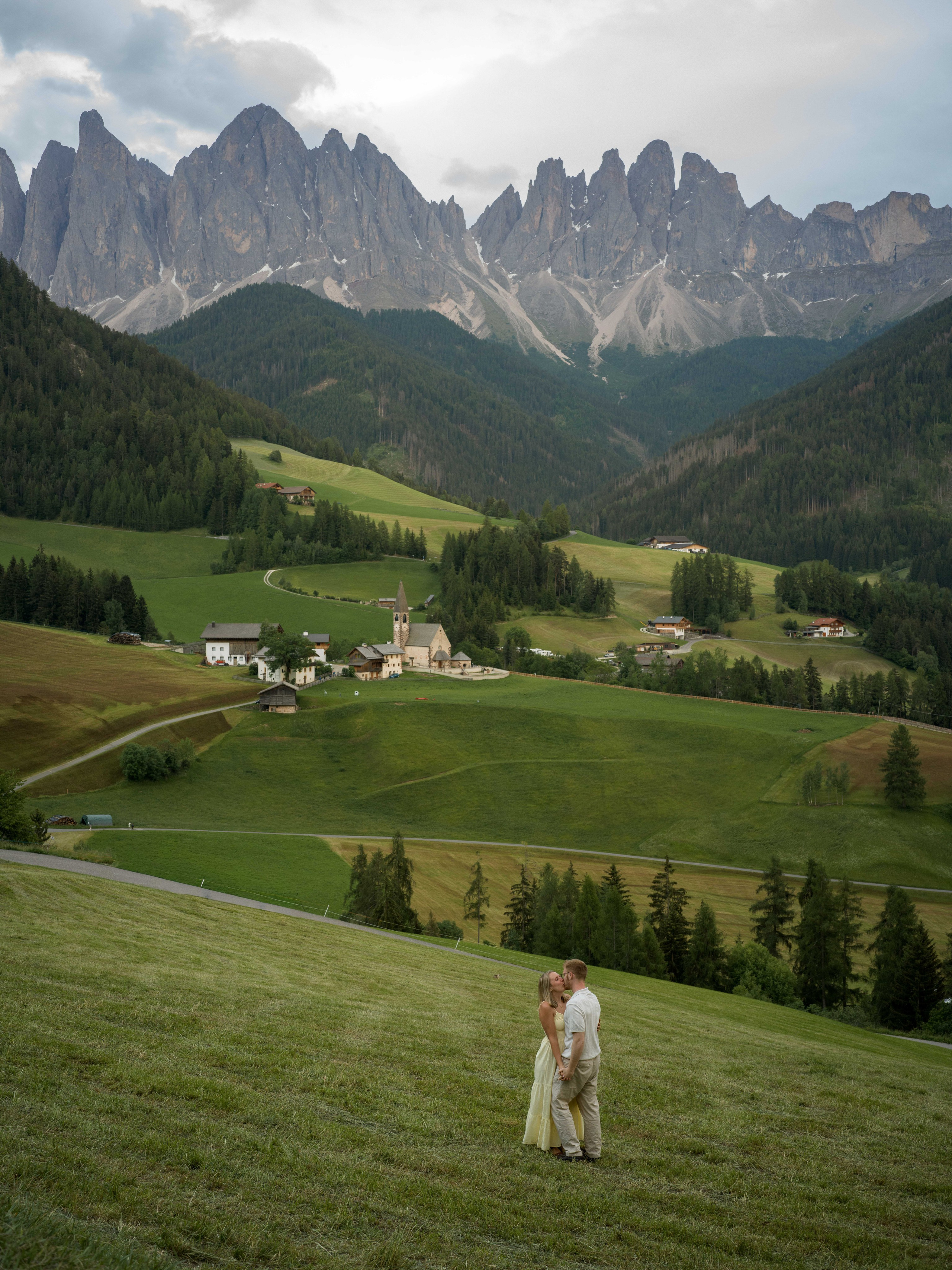 Intimate sunset proposal in Santa Maddalena, Dolomites, Italy, with panoramic Odle mountain views and cinematic fine art couple photography