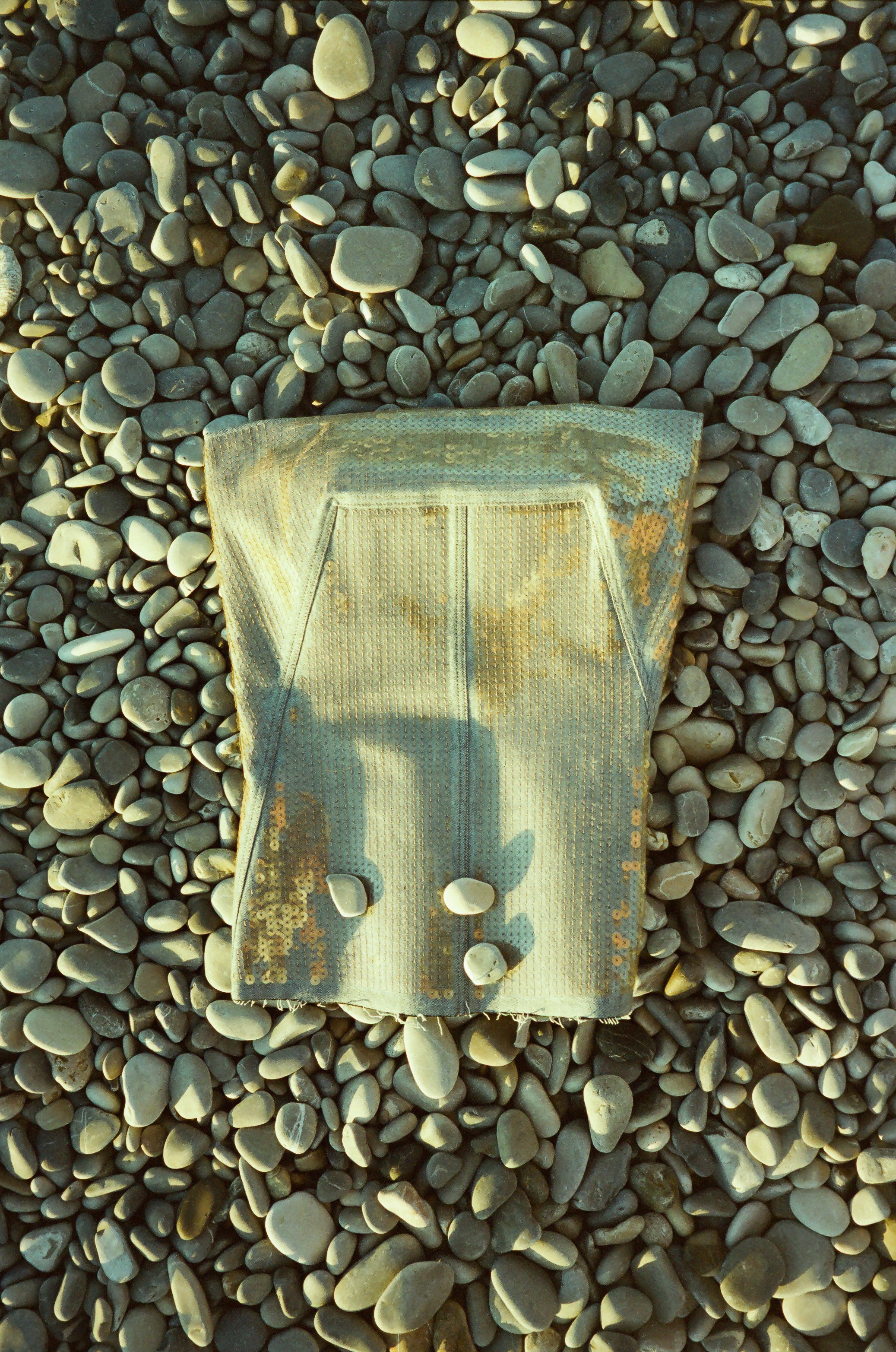 Fine art film photo, Nice, France – model in a Rick Owens corset rising from the sea at sunrise like a mermaid