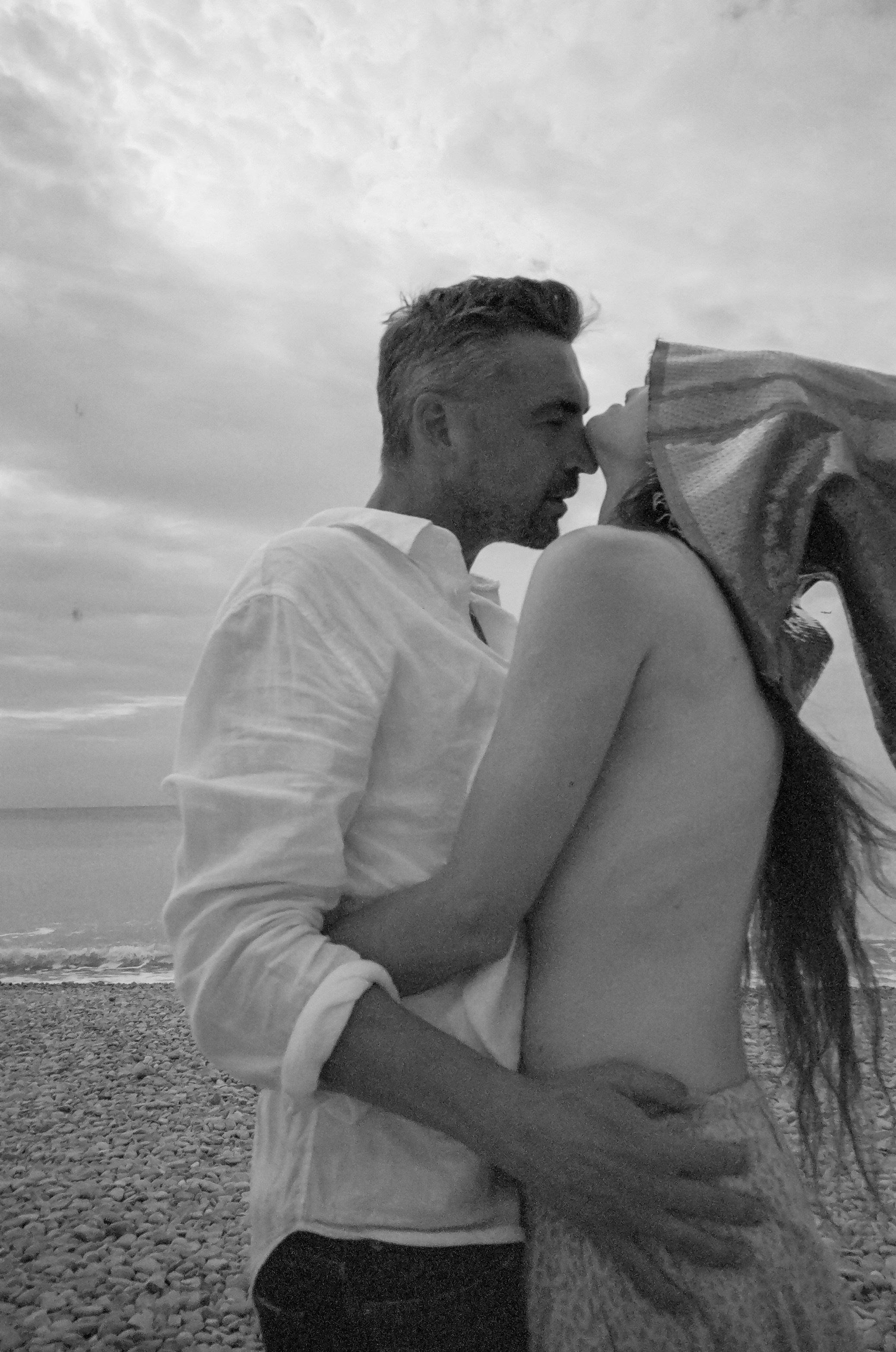 Fine art film photography, Nice, France – flowing fabric and soft waves on the Mediterranean shore at dawn