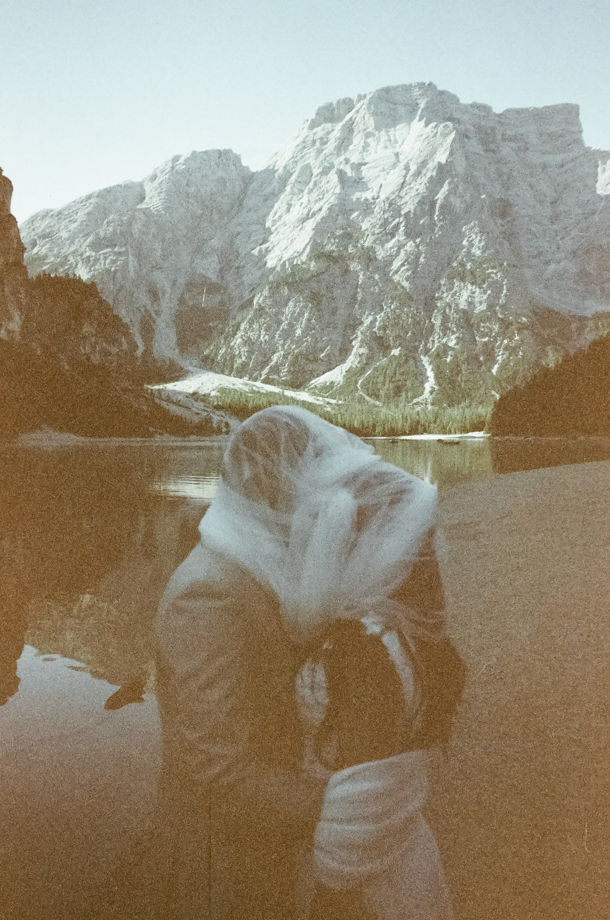 Lake Braies Dolomites elopement with romantic couple portraits on the lake and surrounding mountains, photographed on analog film