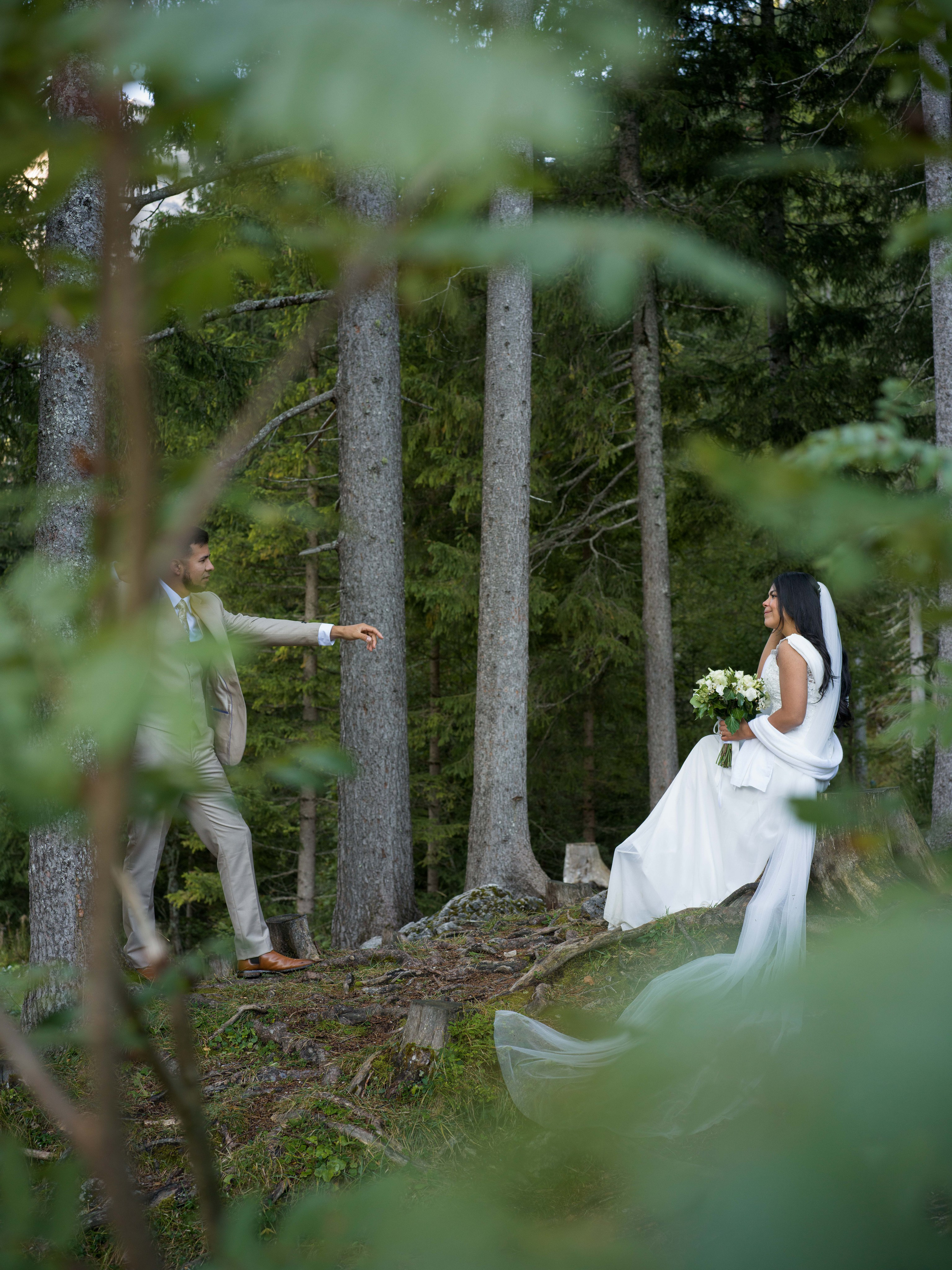 Romantic Lake Braies Dolomites elopement photography with cinematic couple portraits on the boat and around the lake