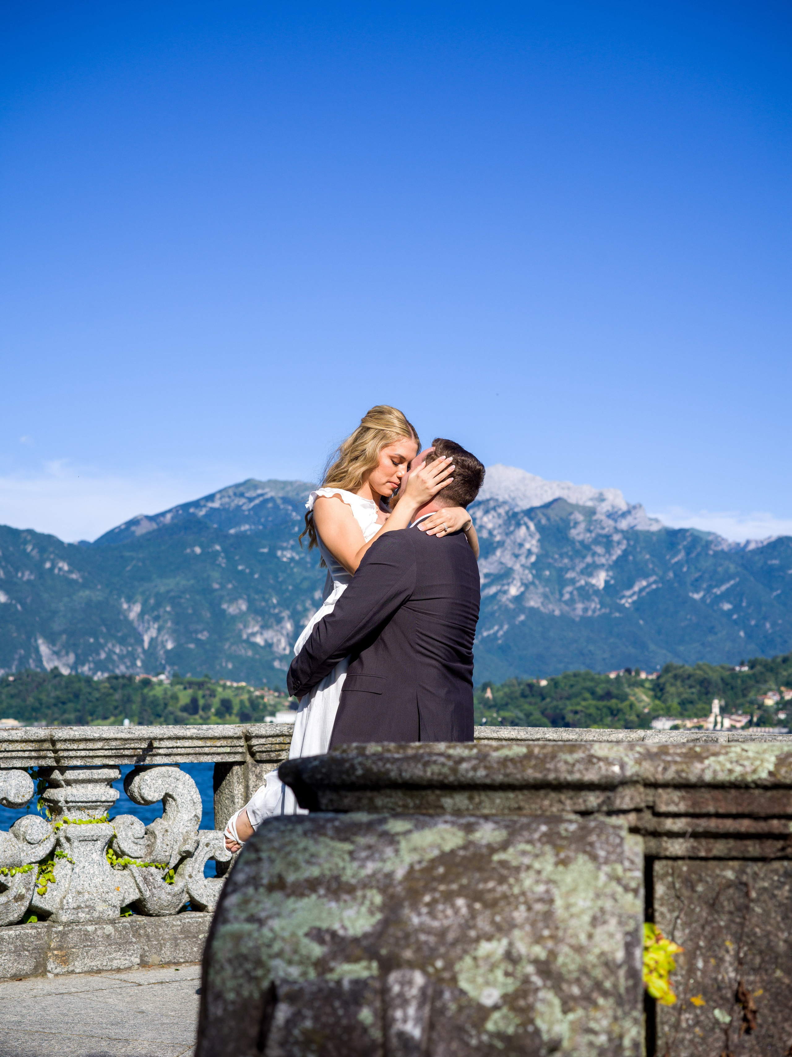 Candid laughing couple portrait in Tremezzo's Parco Civico during golden hour, Lake Como elopement
