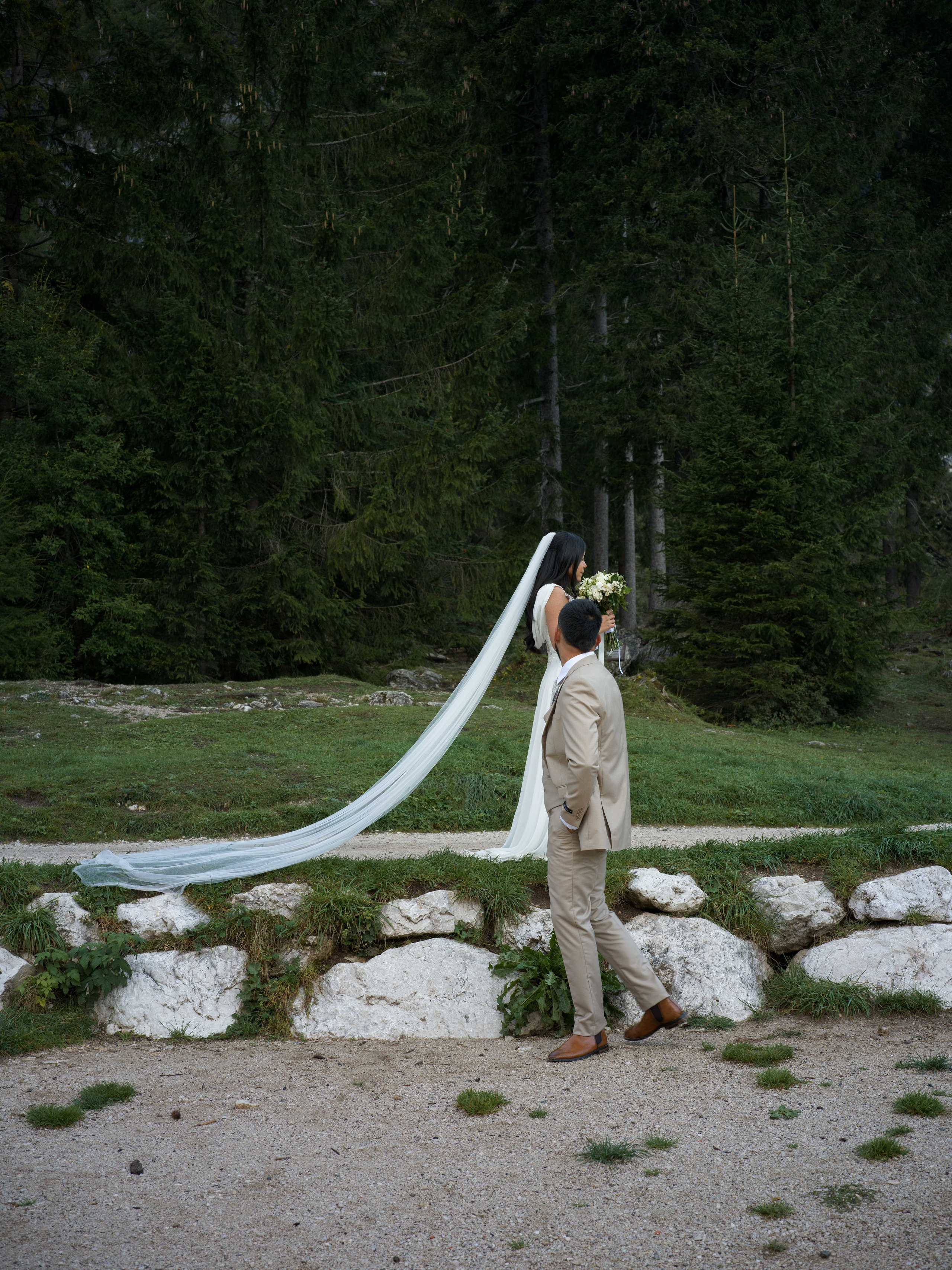 Sunrise elopement at Lake Braies in the Dolomites, Italy, with cinematic couple photography surrounded by the Italian Alps