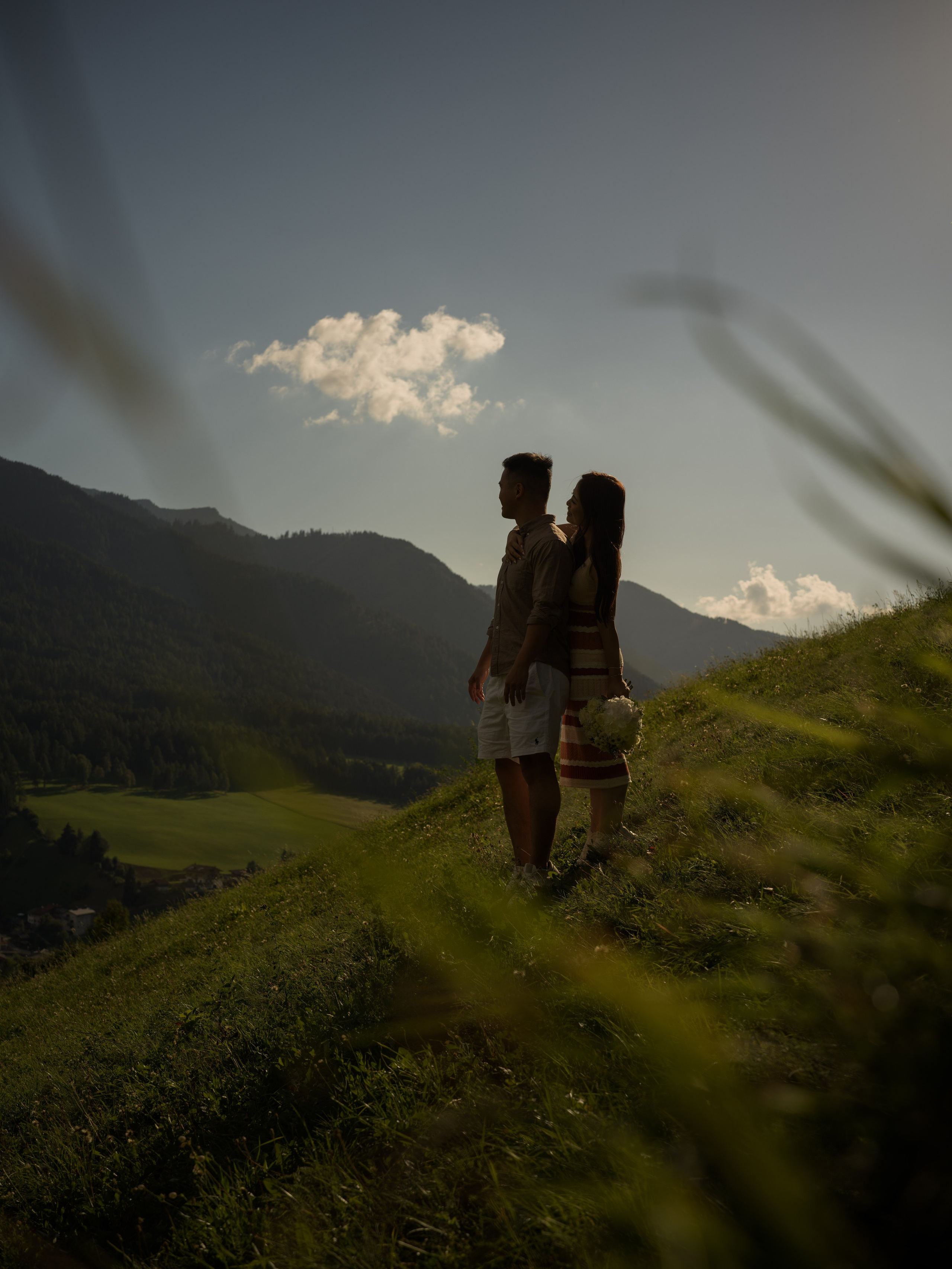 Proposal at Santa Maddalena in the Dolomites at sunset, romantic engagement moment with dramatic mountain views
