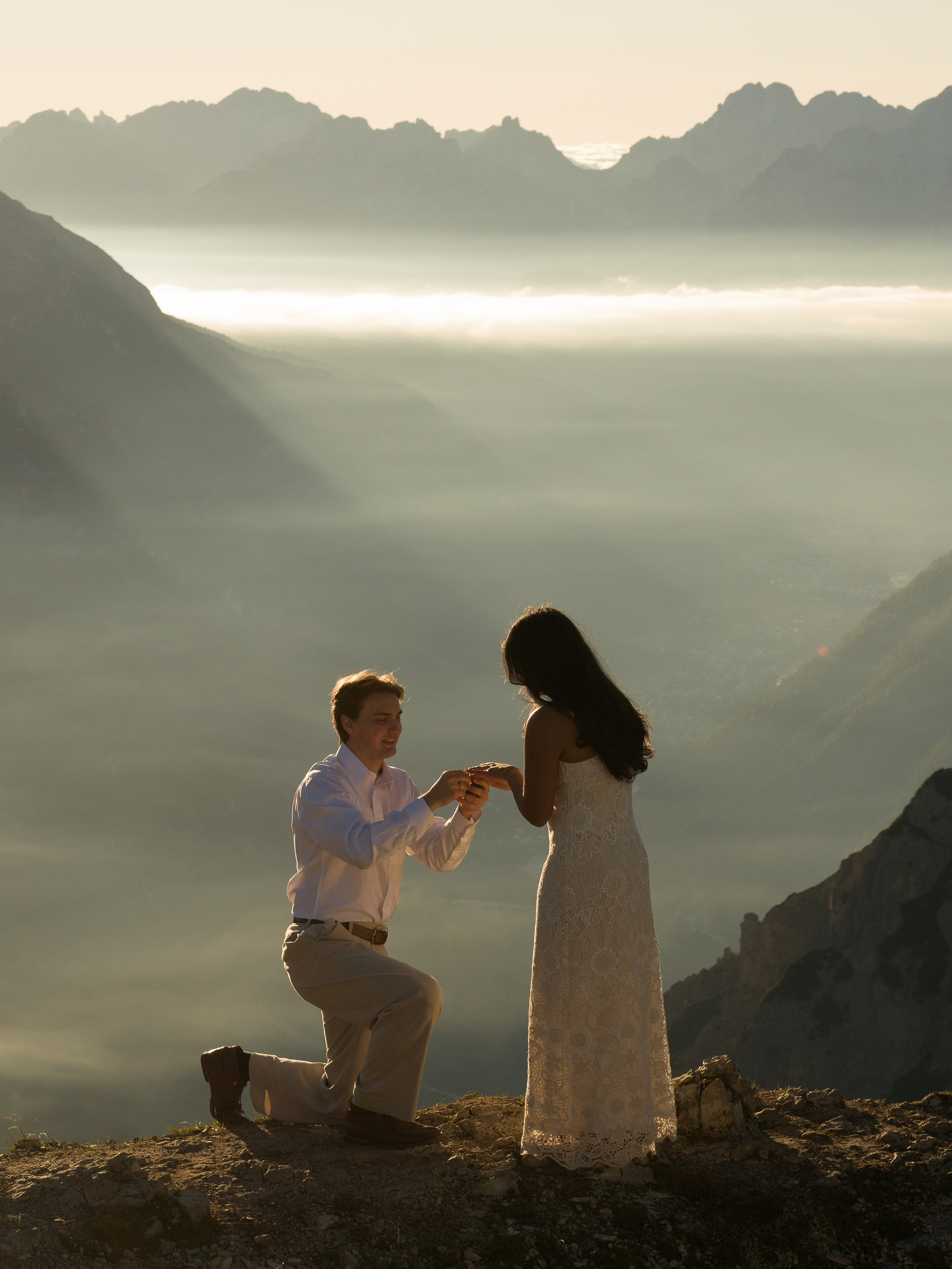 Proposal, Cadini di Misurina, Tre Cime di Lavaredo, Dolomites – he puts the ring on her finger above the clouds at sunrise