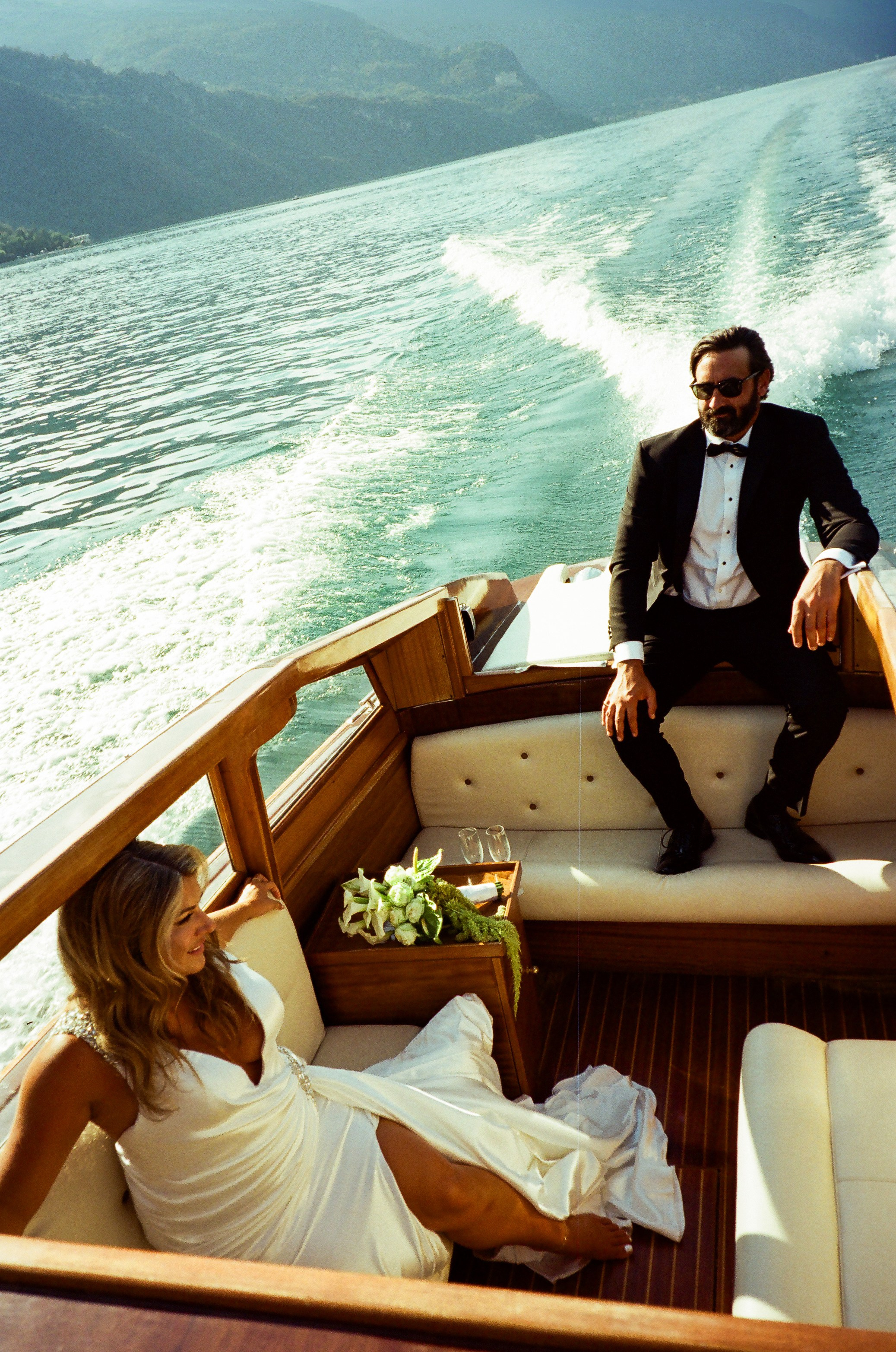 Villa Giulia Lake Como elopement with a couple on a traditional wooden boat, photographed on analog film