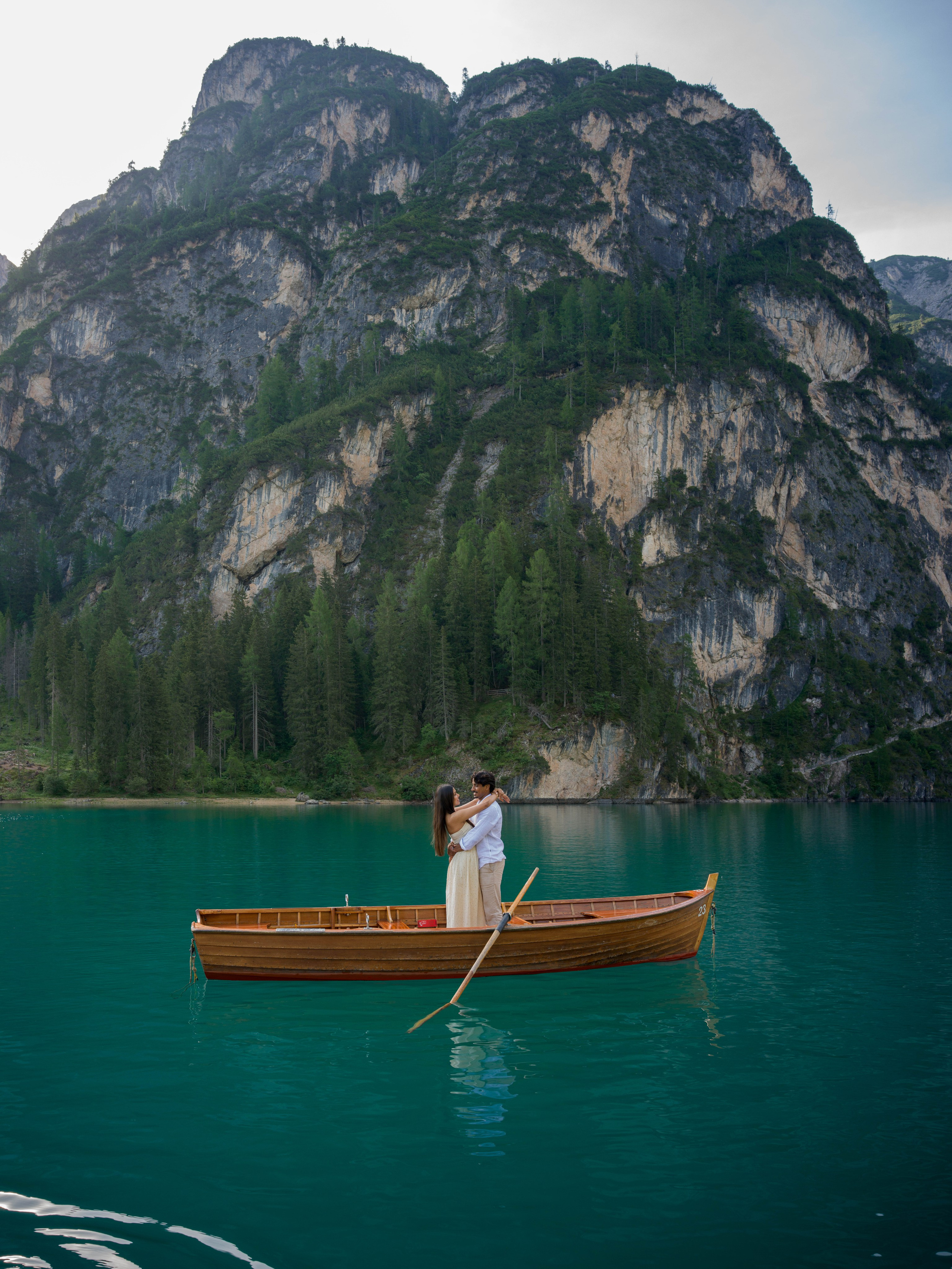 Lake Braies proposal in the Dolomites captured with natural couple photography and cinematic lake views