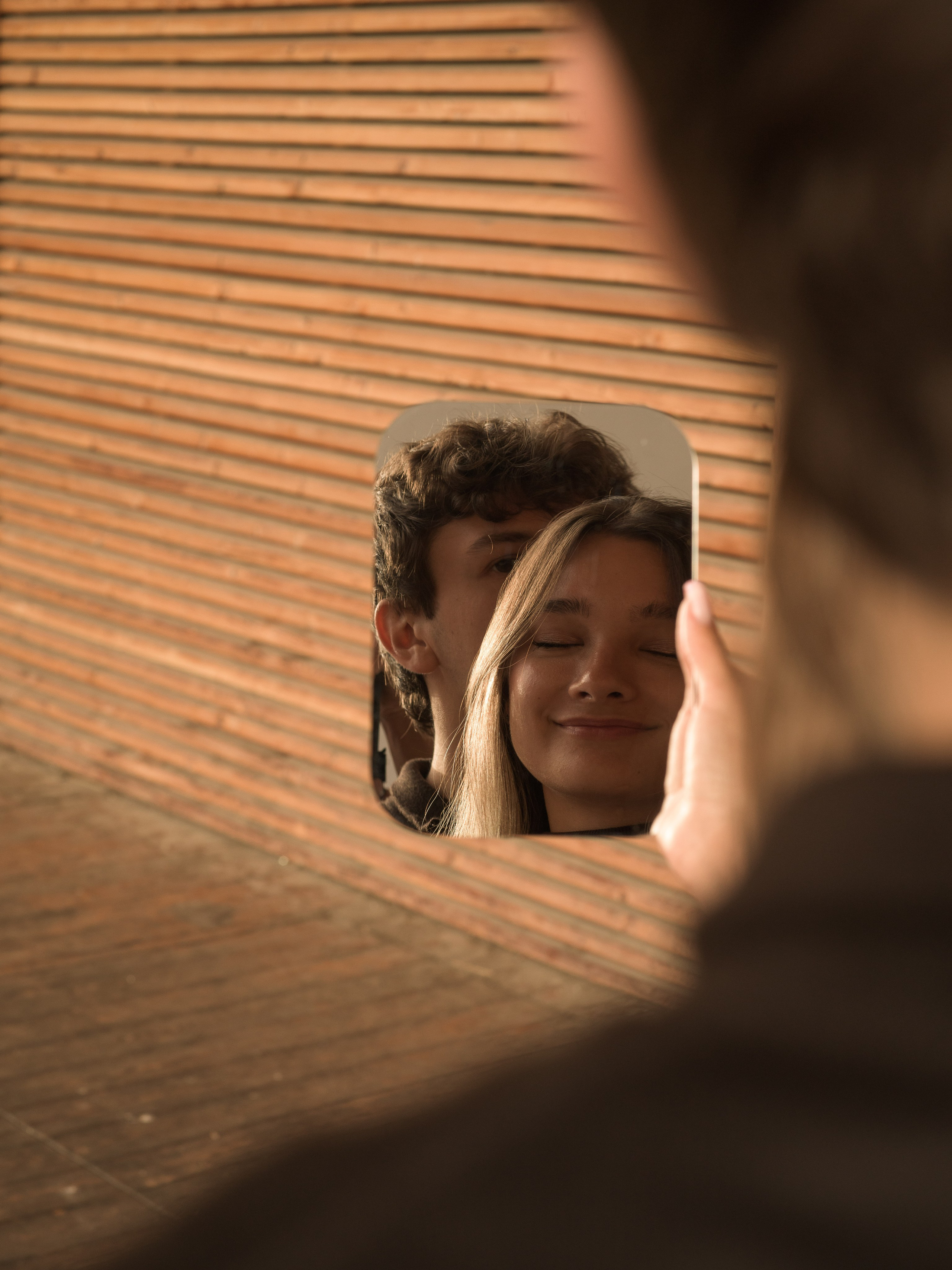 Romantic marriage proposal in Santa Maddalena, Val di Funes, with the iconic Odle peaks behind the couple, photographed by a Dolomites proposal and engagement photographer.