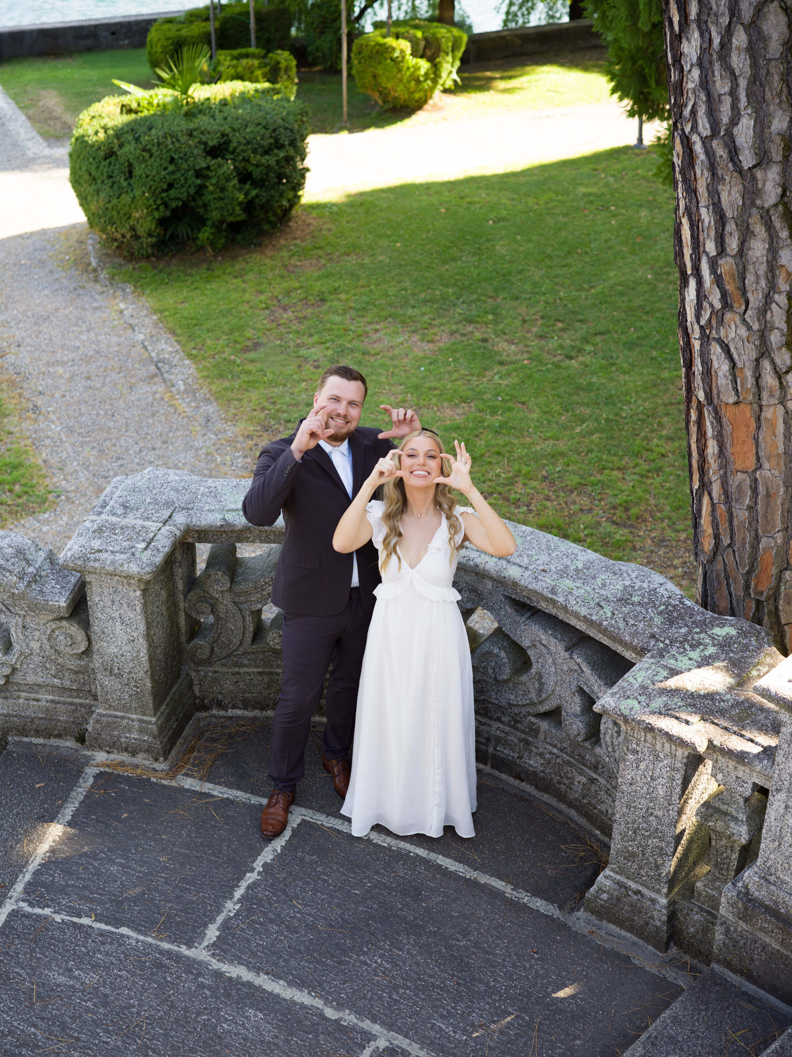 Bride in a flowing dress and groom in the lakeside park of Tremezzo, elopement photography on Lake Como