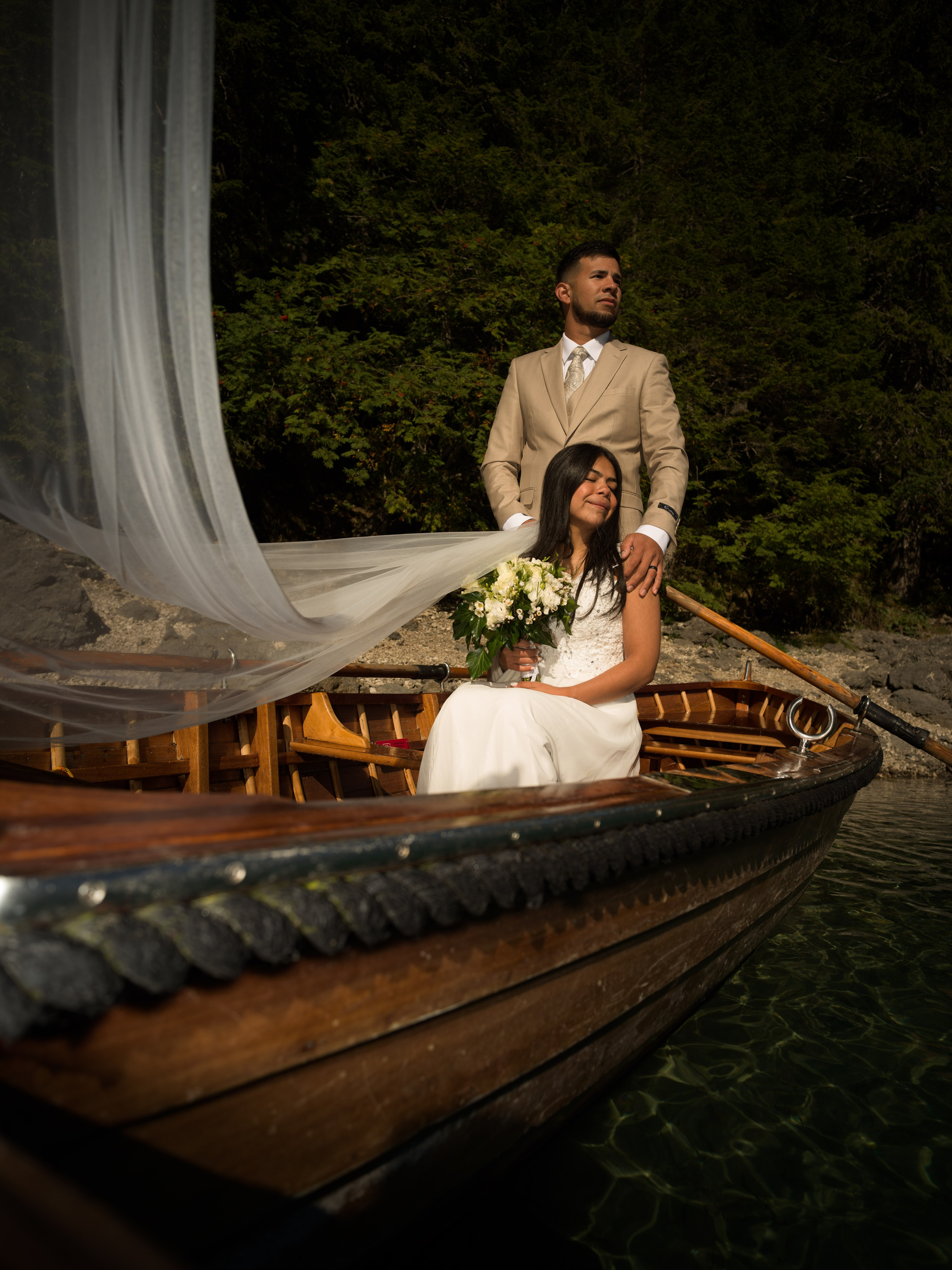 Lake Braies elopement in the Dolomites photographed and filmed on the lake, wooden boat and surrounding mountain landscape