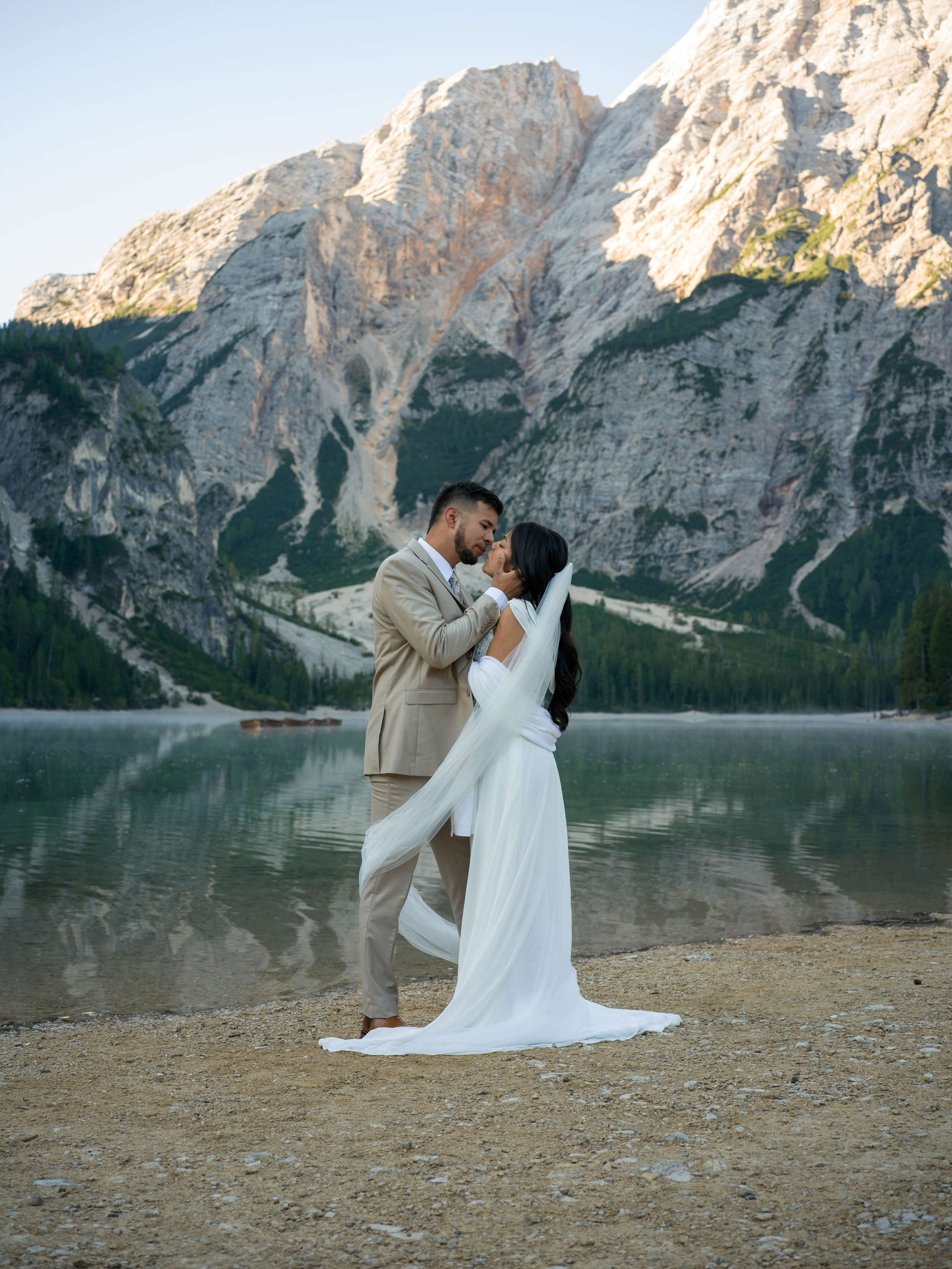 Elopement, Lake Braies, The Dolomites, Italy – fine art kiss by the turquoise lake