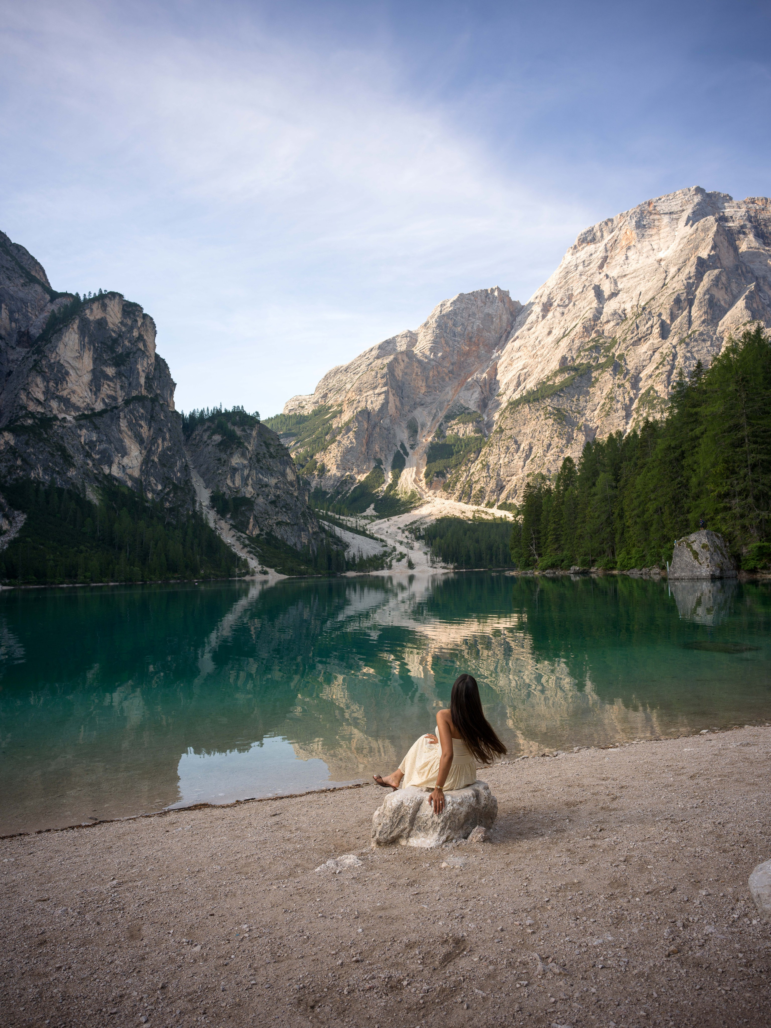 Romantic proposal at Lake Braies in the Dolomites with intimate couple portraits and mountain scenery