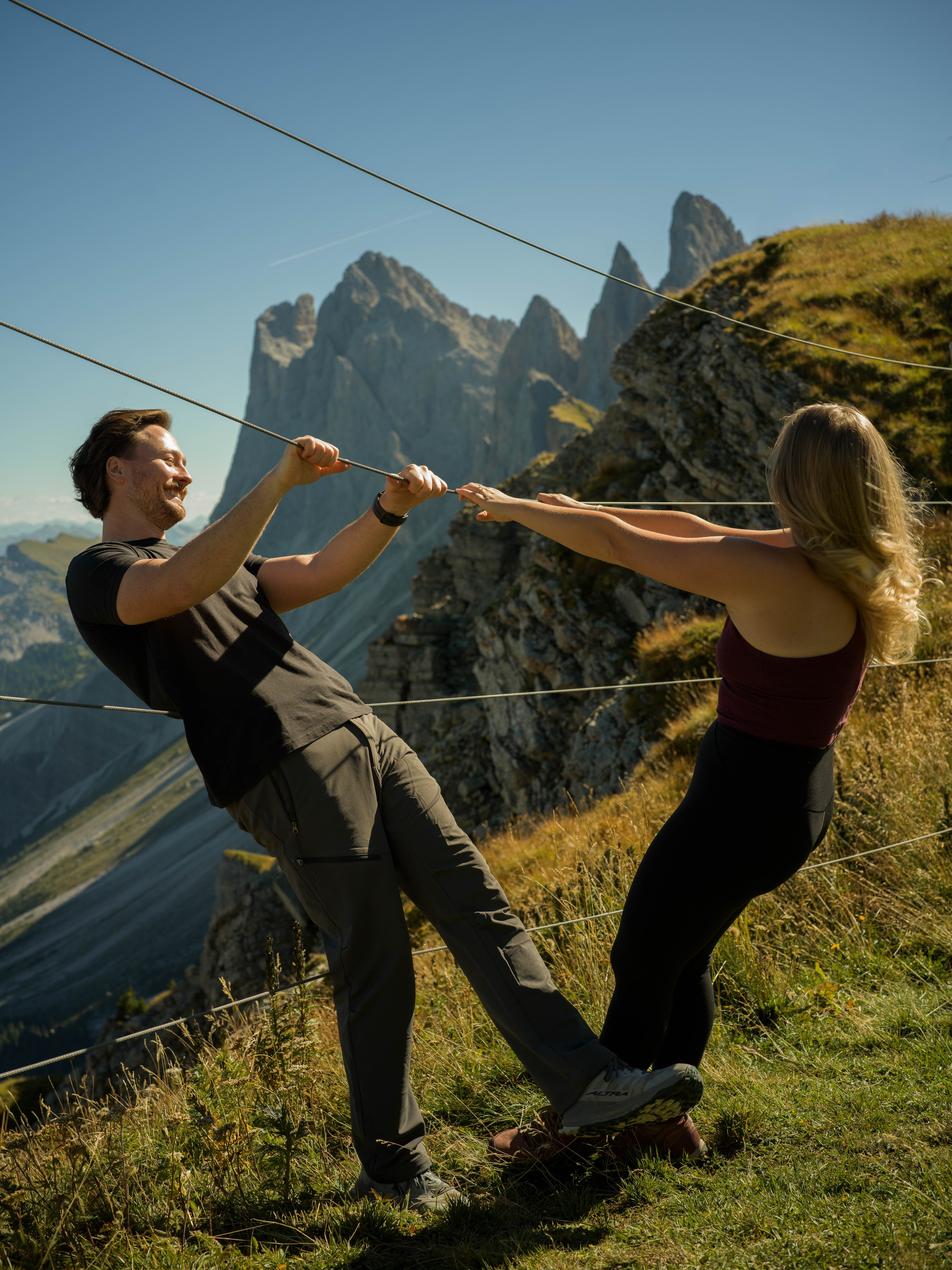 Intimate engagement proposal at Seceda, Dolomites, photographed at sunrise with panoramic views of the Italian Alps.