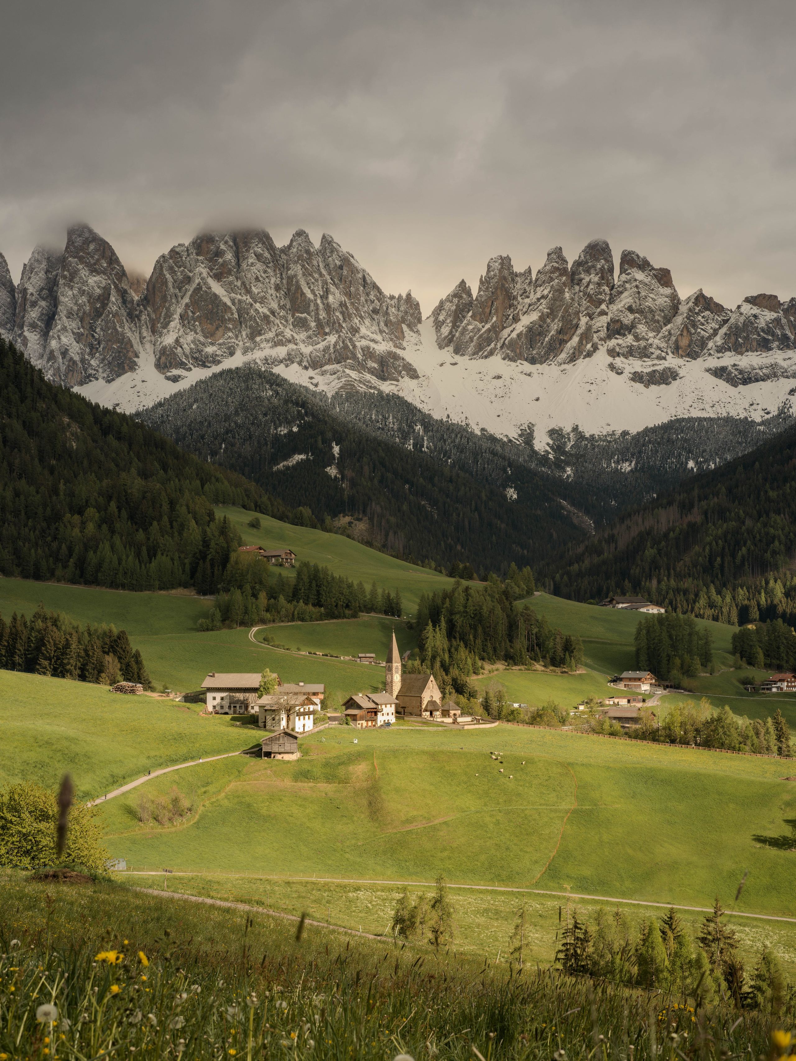 Santa Maddalena village in Val di Funes surrounded by the dramatic Dolomite mountains