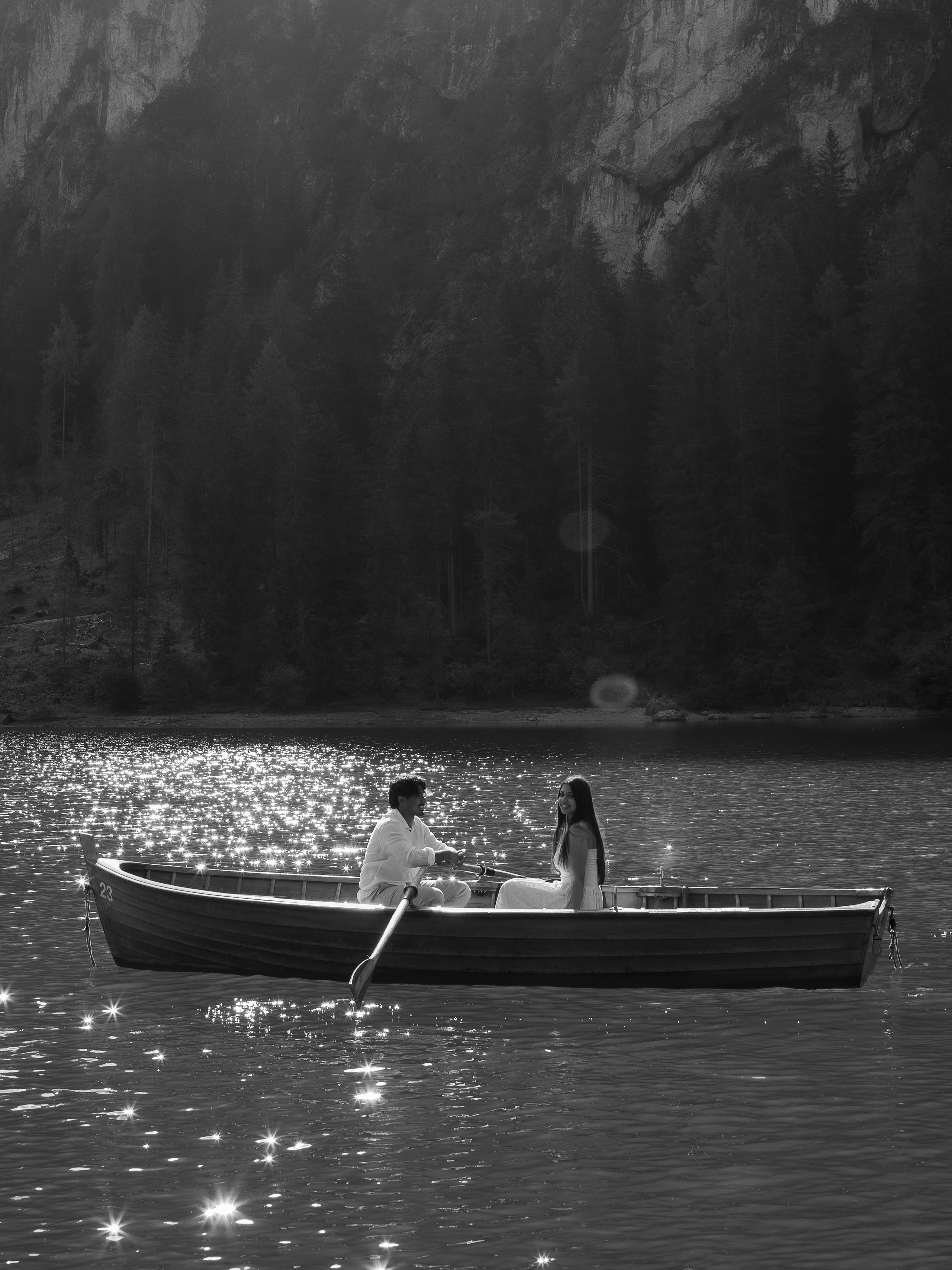 Proposal at Lake Braies in the Dolomites, captured on a private boat at sunset, with the couple surrounded by the dramatic alpine landscape.