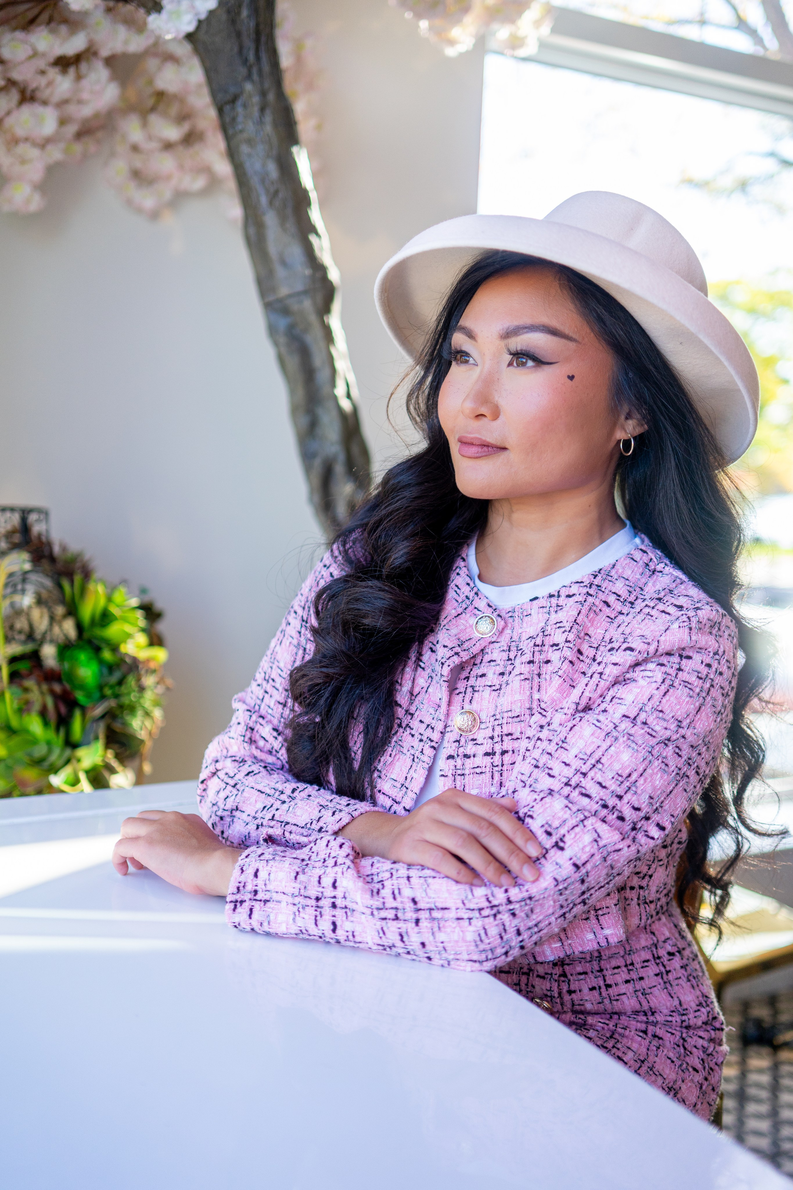 A stylish portrait session in a charming café in Windsor, showcasing your personal style with a creative touch.