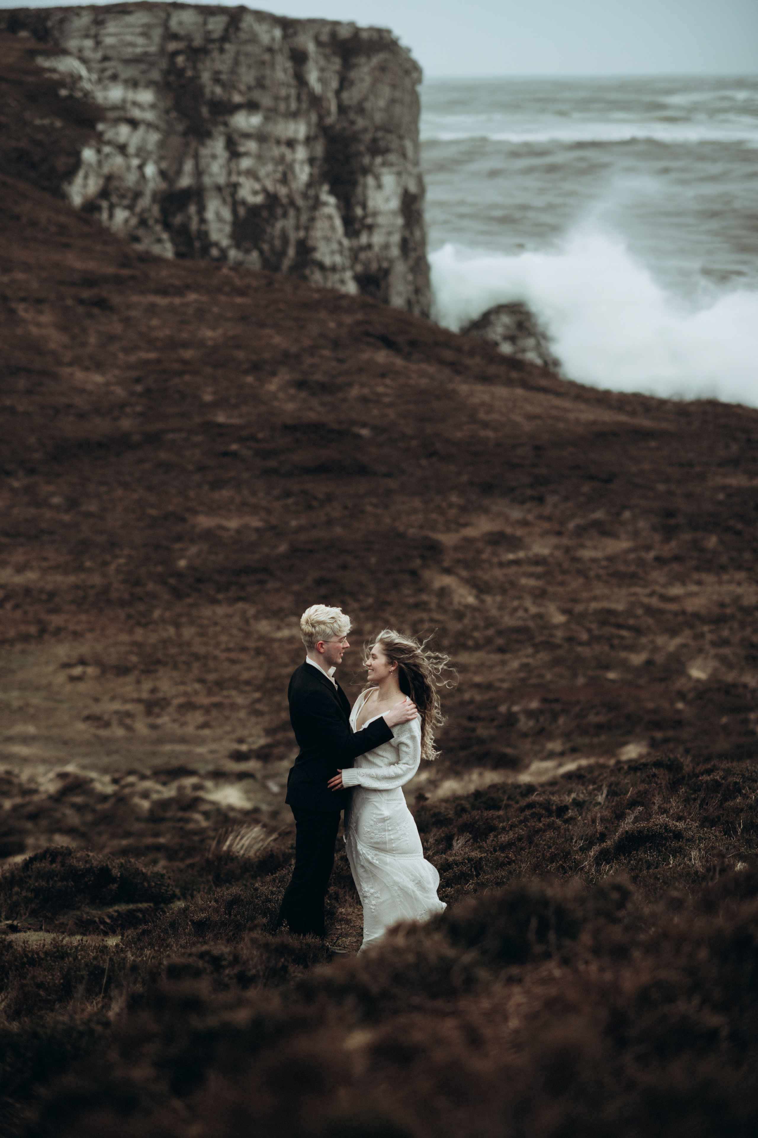 engaged couple on the cliffs