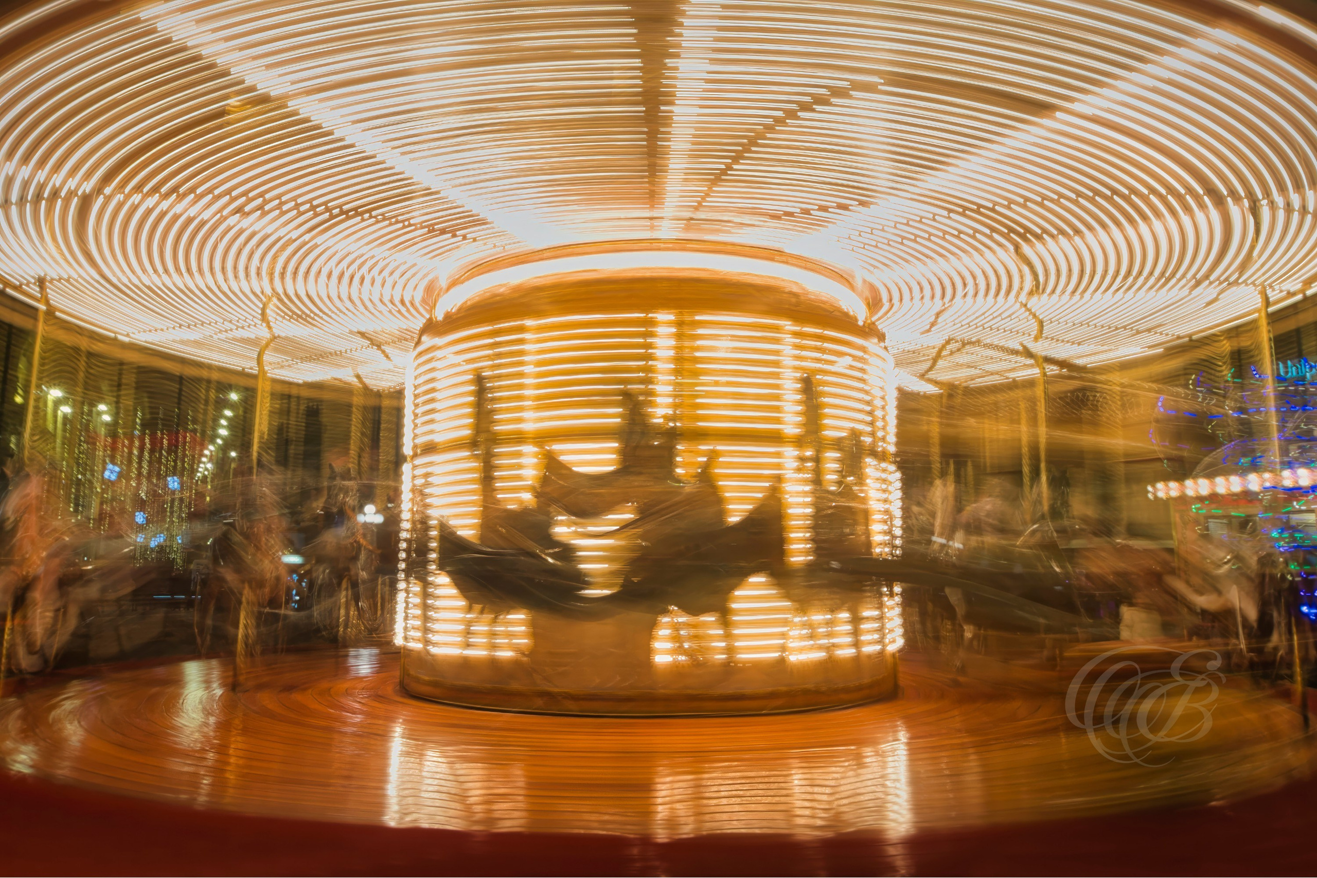 Florence, Italy — Carousel Long Exposure — Long exposure photograph of a carousel in Florence, capturing motion within the historic urban setting — Photography by Eduardo Bartoli.