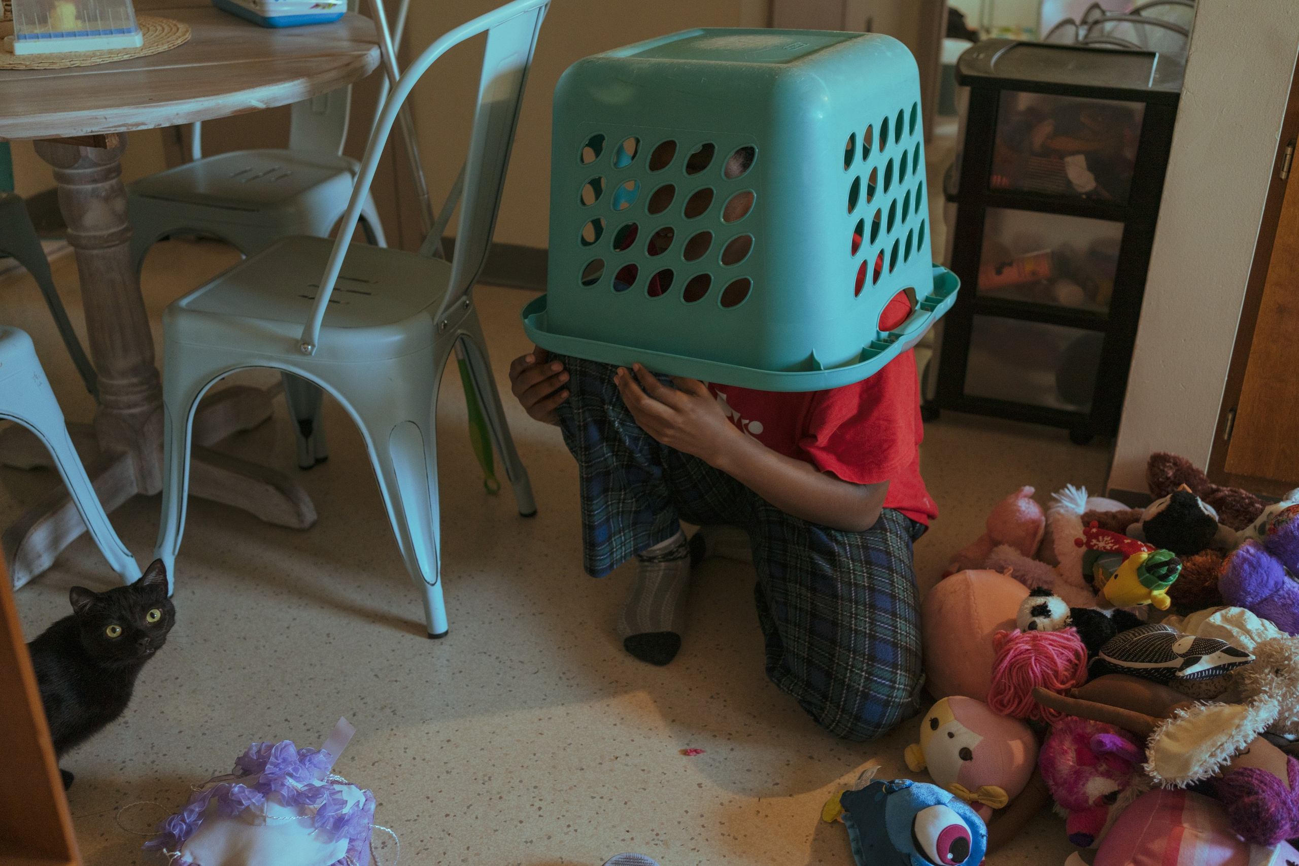 Coco is playing in the kitchen while her mom is rushing to make a dinner.