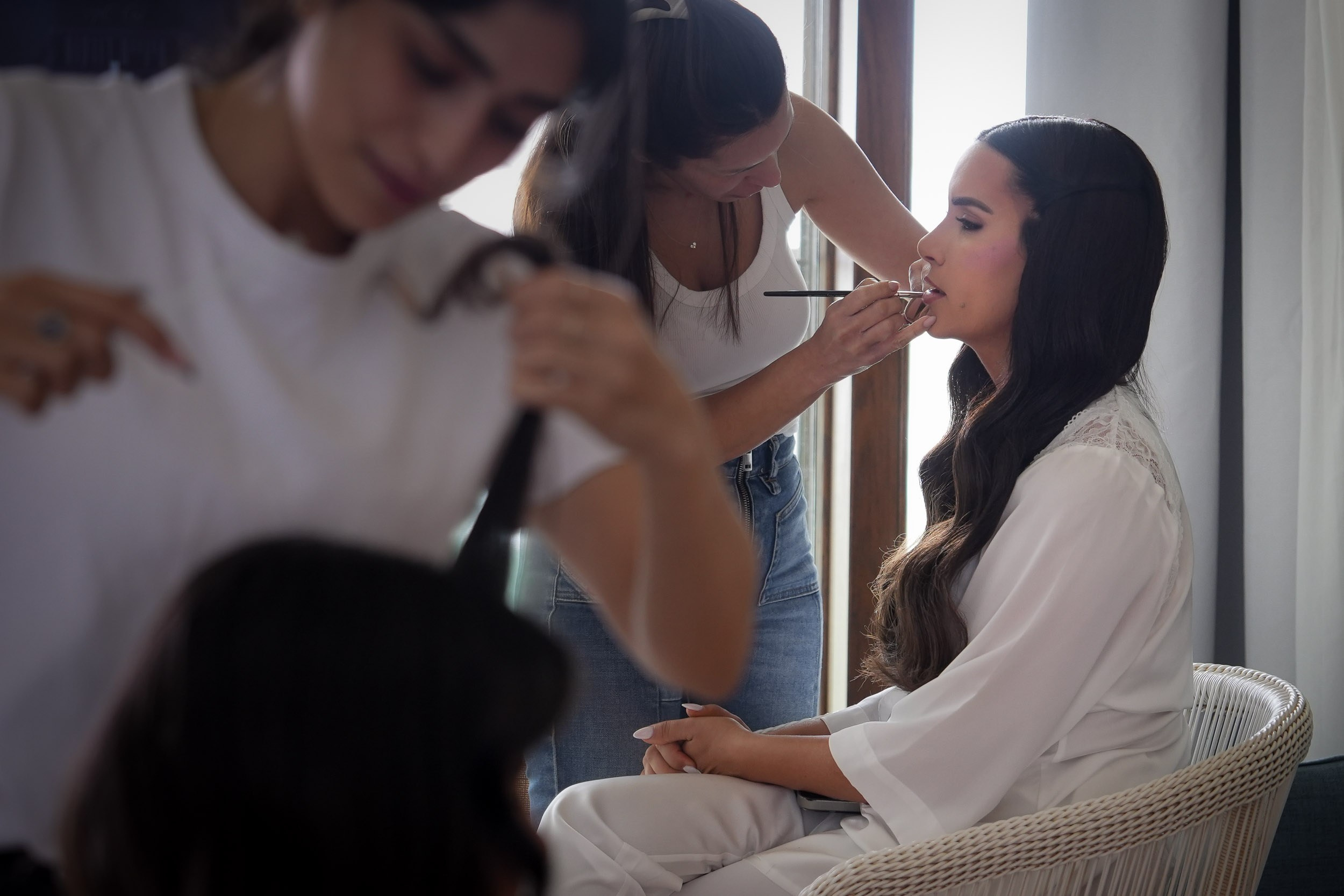 Bride Shani having her wedding makeup and hair styling done during morning preparations in Zikhron Ya'akov, Israel