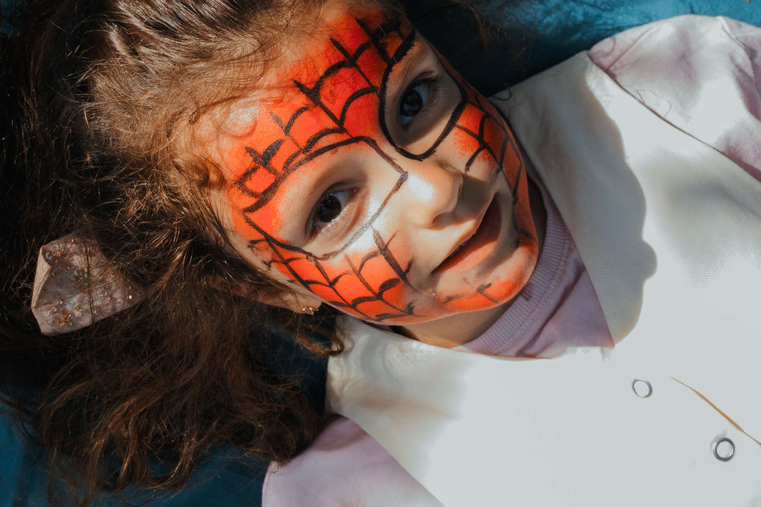 Family photosession. Lovely children. Carnival mask