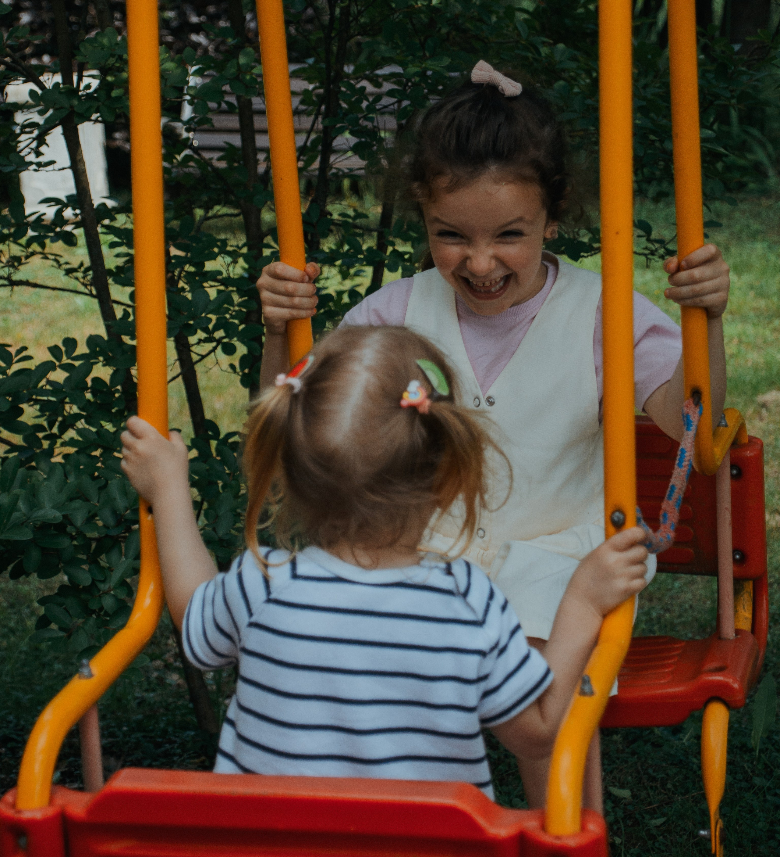 Family photoshooting. Two children in the playground