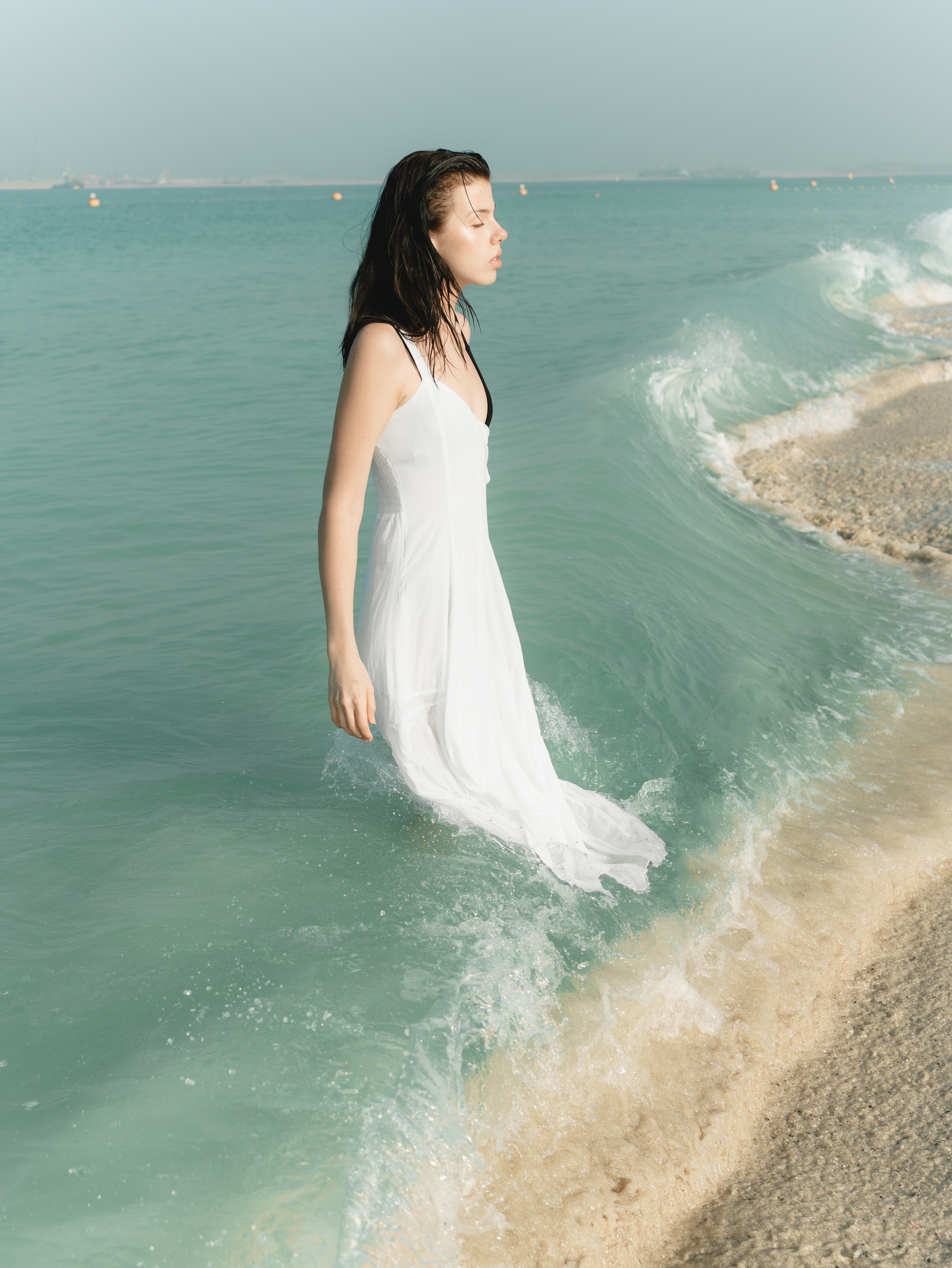 Fashion portrait series on the beach in minimalistic swimwear look. Alisha Geva | Contemporary fashion women’s portrait Dubai