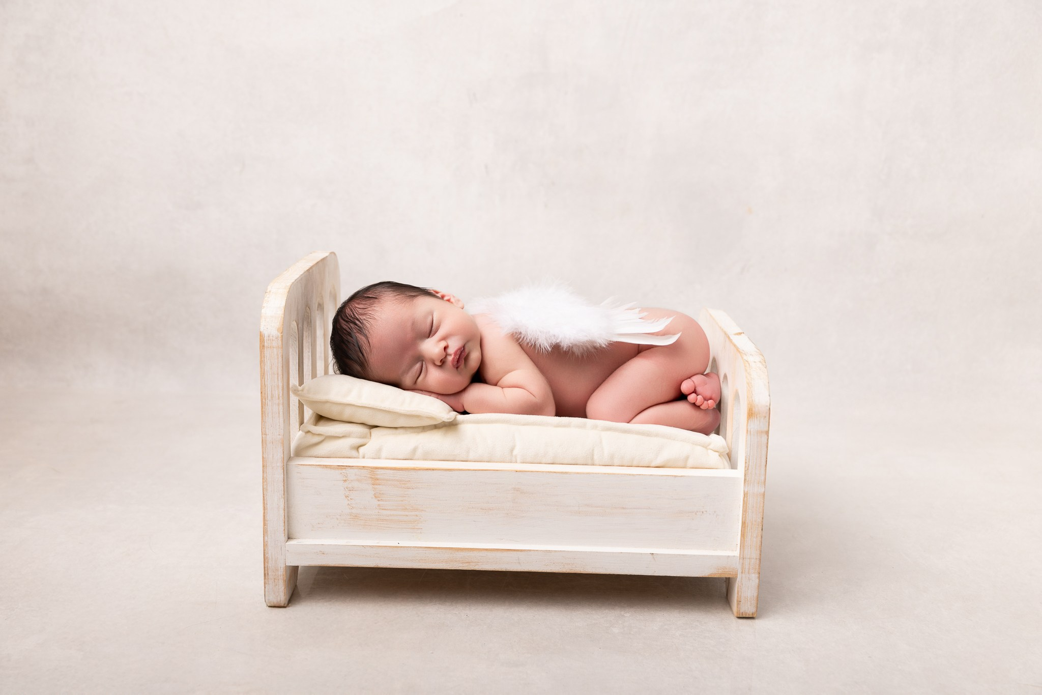 Angel Newborn Photoshoot. Professional family, maternity & newborn photographer in North Charleston, SC, creating timeless portraits