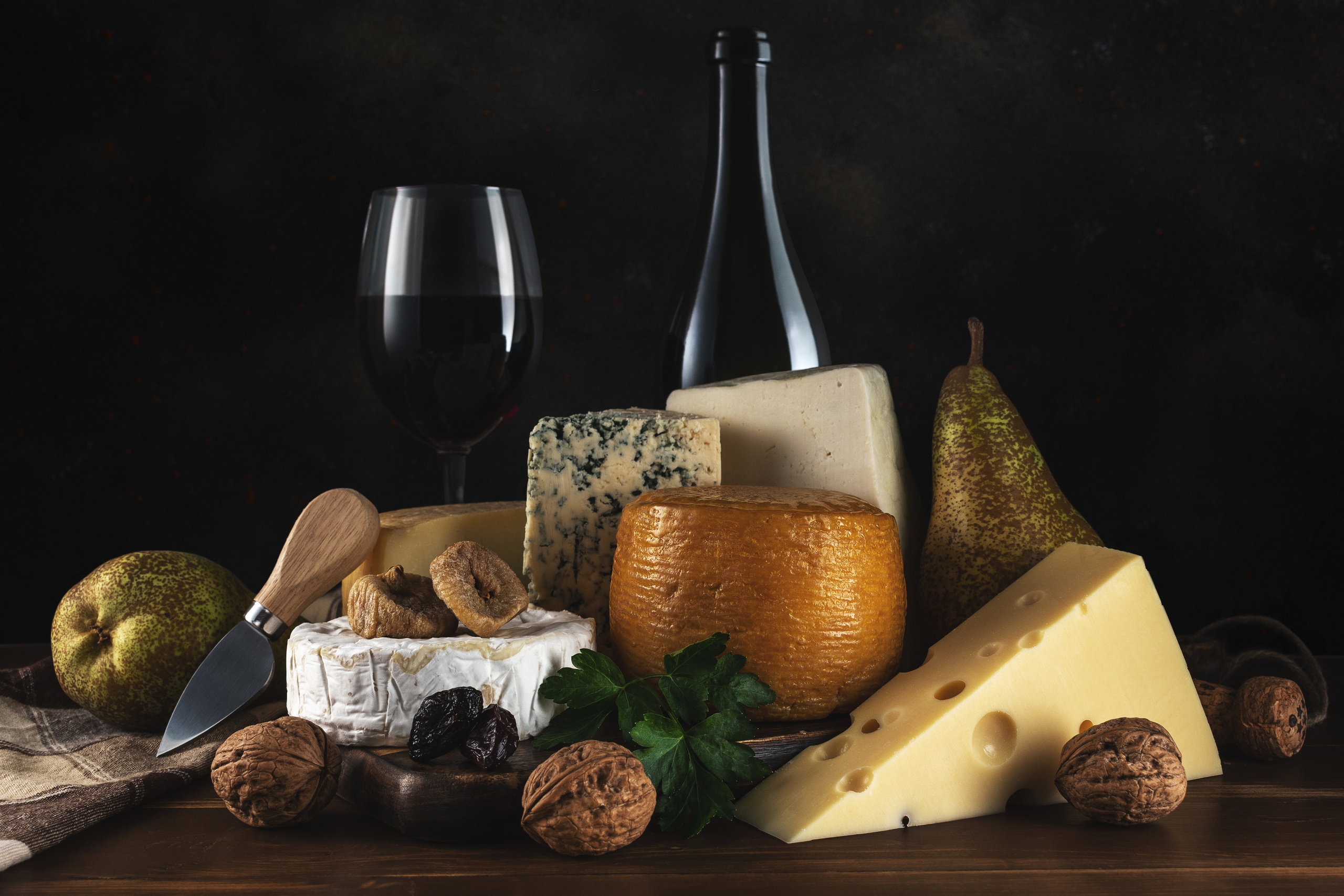 Homemade cake with fresh berries and sweet desserts on dark background. 