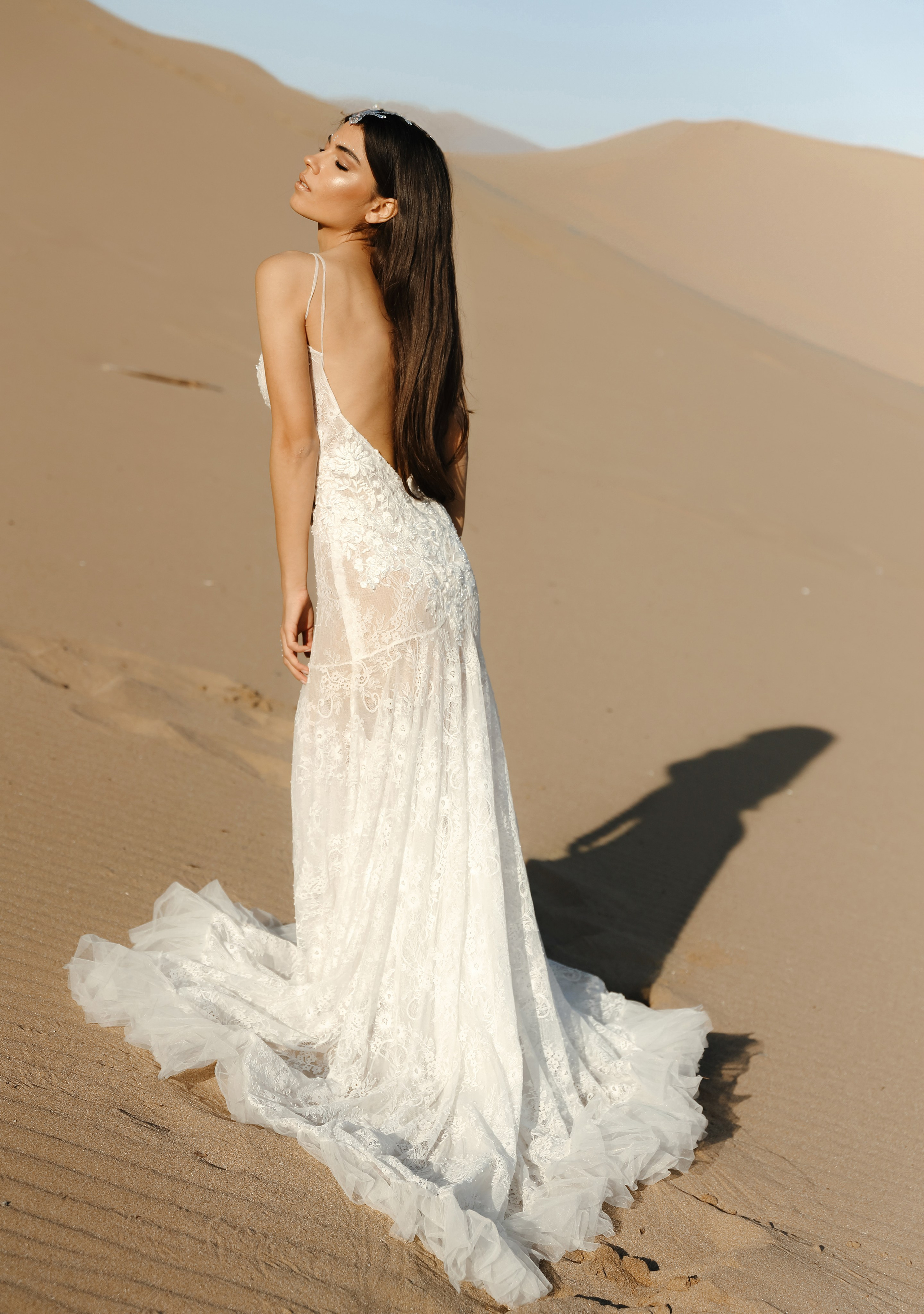Art photoshoot of a girl in a wedding dress in the desert on a beach Tsampika in Rhodes