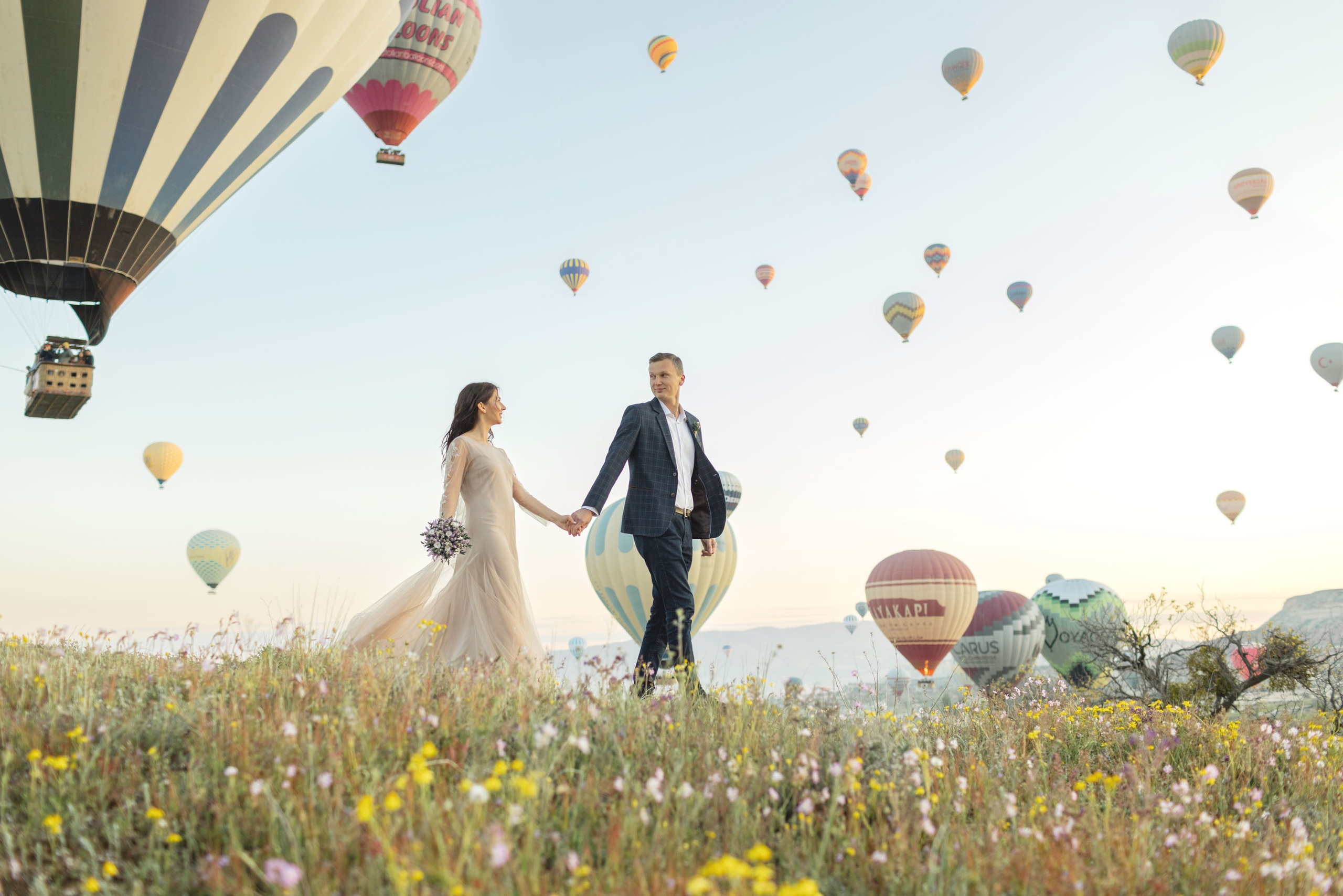 Magical Wedding Photoshoot in Cappadocia: Balloons, Caves, and Valleys. Julia Ganch I Fashion Wedding Photography I Cappadocia Turkey