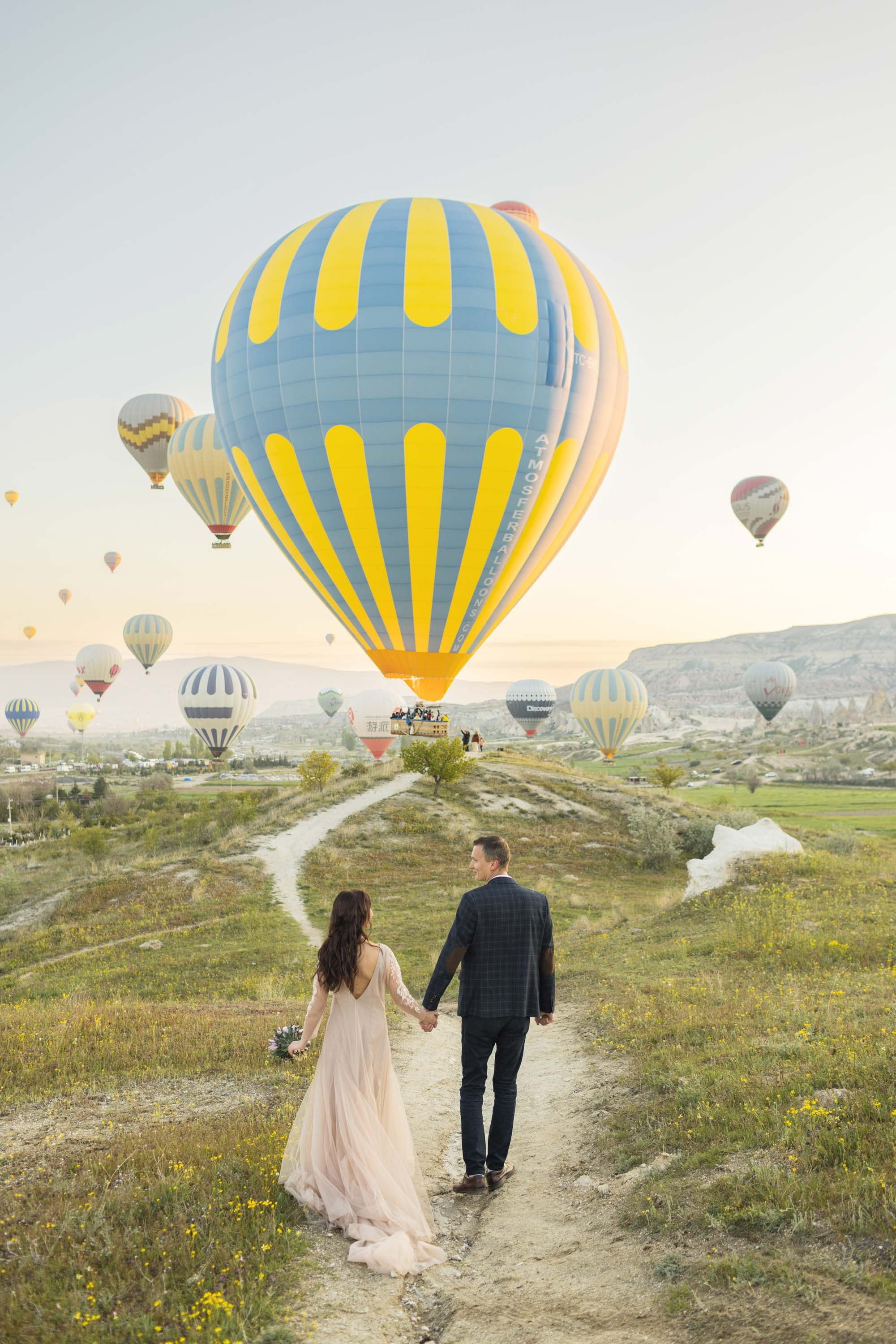 Magical Wedding Photoshoot in Cappadocia: Balloons, Caves, and Valleys. Julia Ganch I Fashion Wedding Photography I Cappadocia Turkey