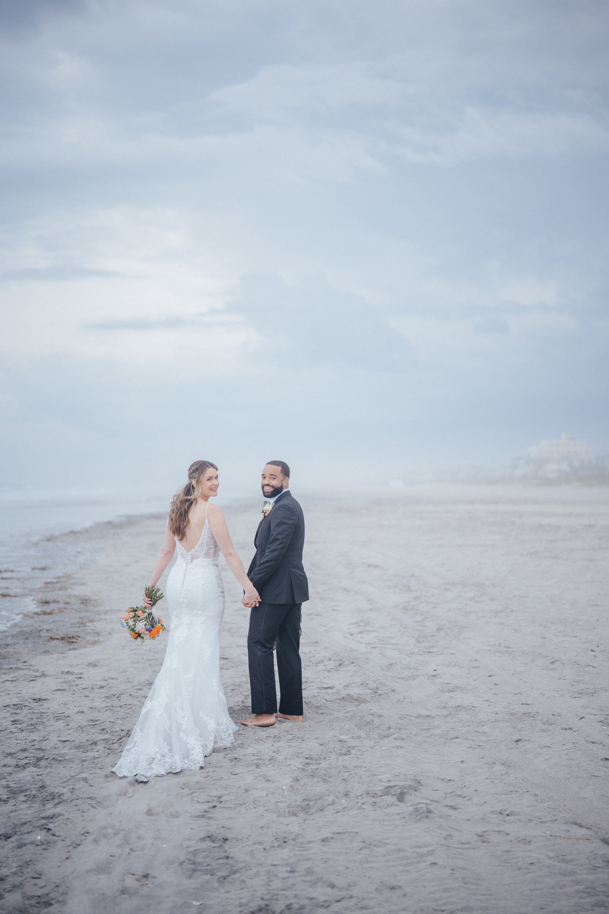Wedding walk on the beach. Portrait and wedding photographer in New York