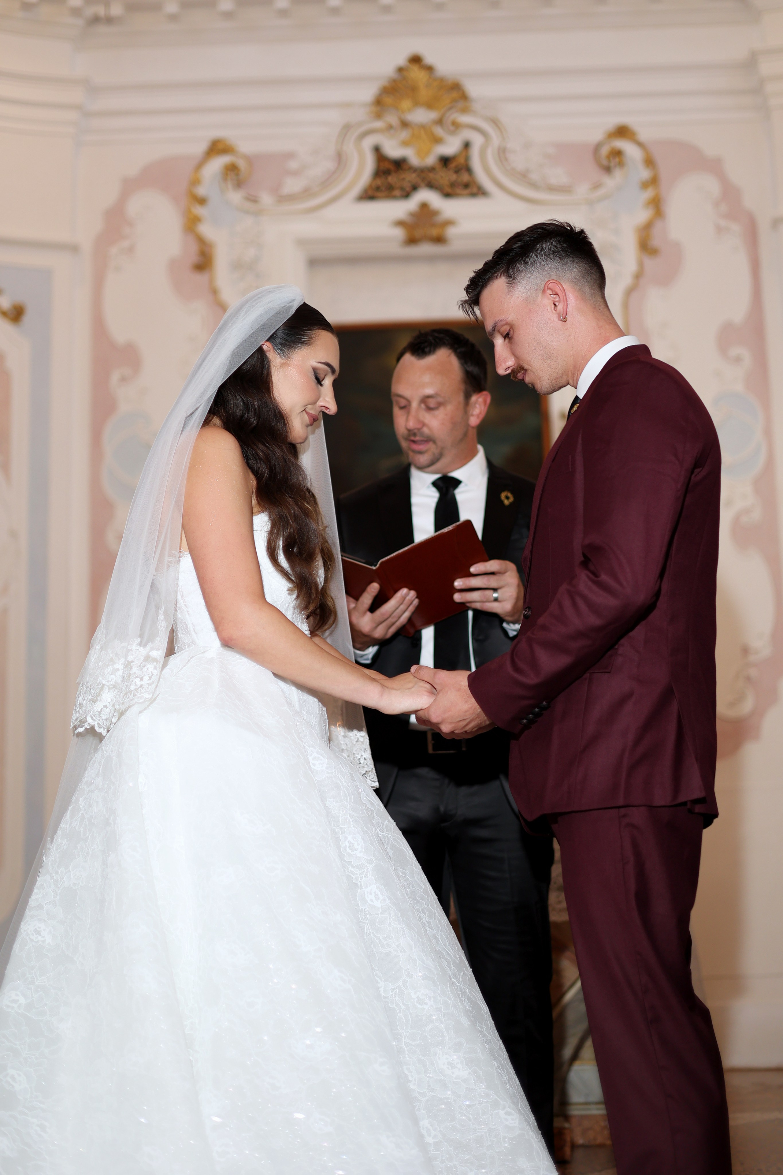 The couple exchanging vows in front of family and friends