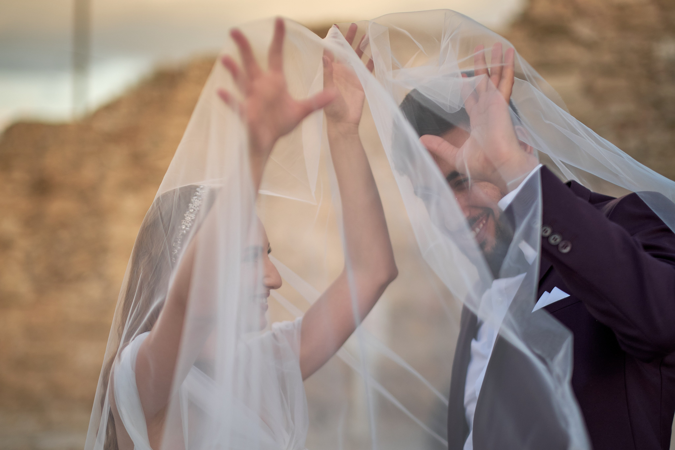 Love Story , wedding Romantic wedding couple portrait, bride with veil and groom in suit, emotional wedding photography by Maxim Polak Israel