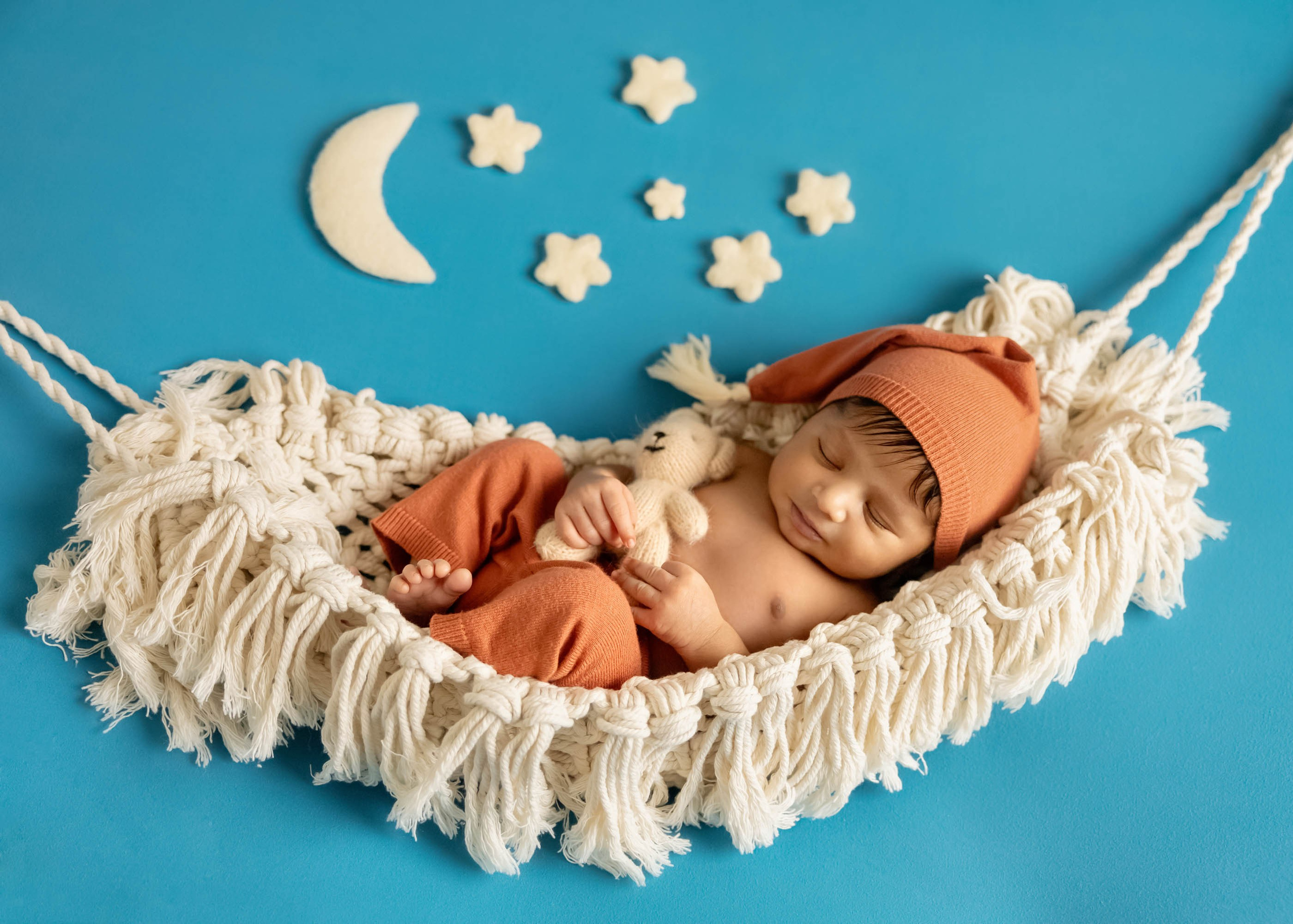 baby sleeping in hummock under the stars