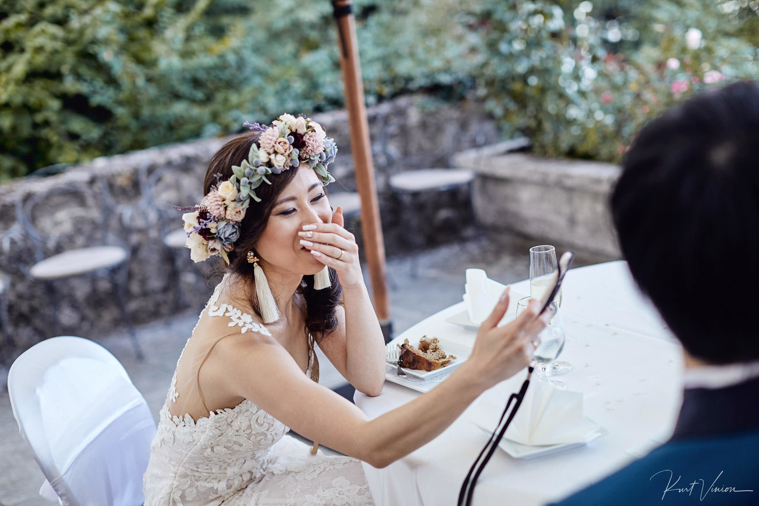 Radiant bride on video call with family Japan Lake Bled wedding.