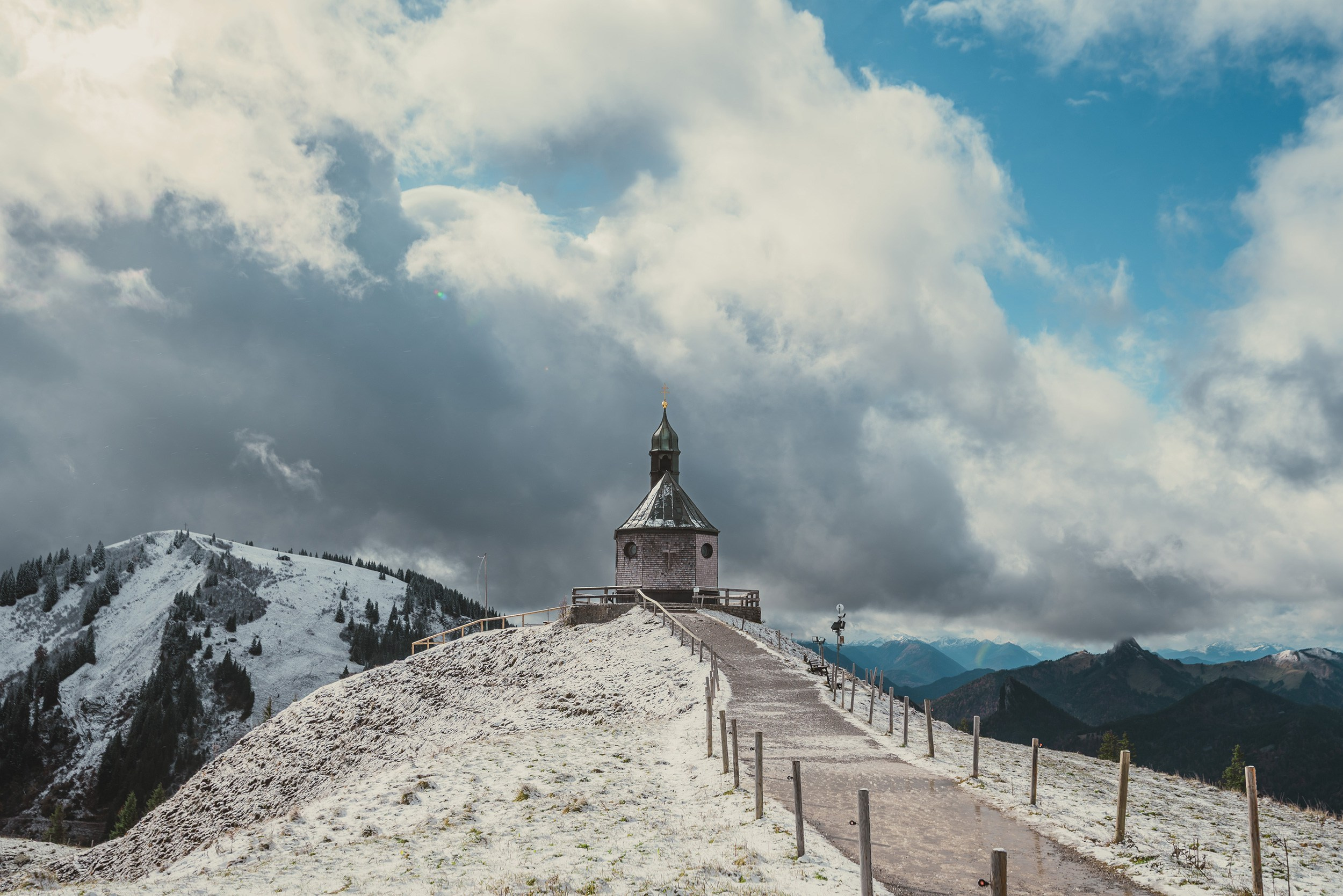 The historic Wallbergkapelle mountain chapel on the snow-covered summit of Wallberg.