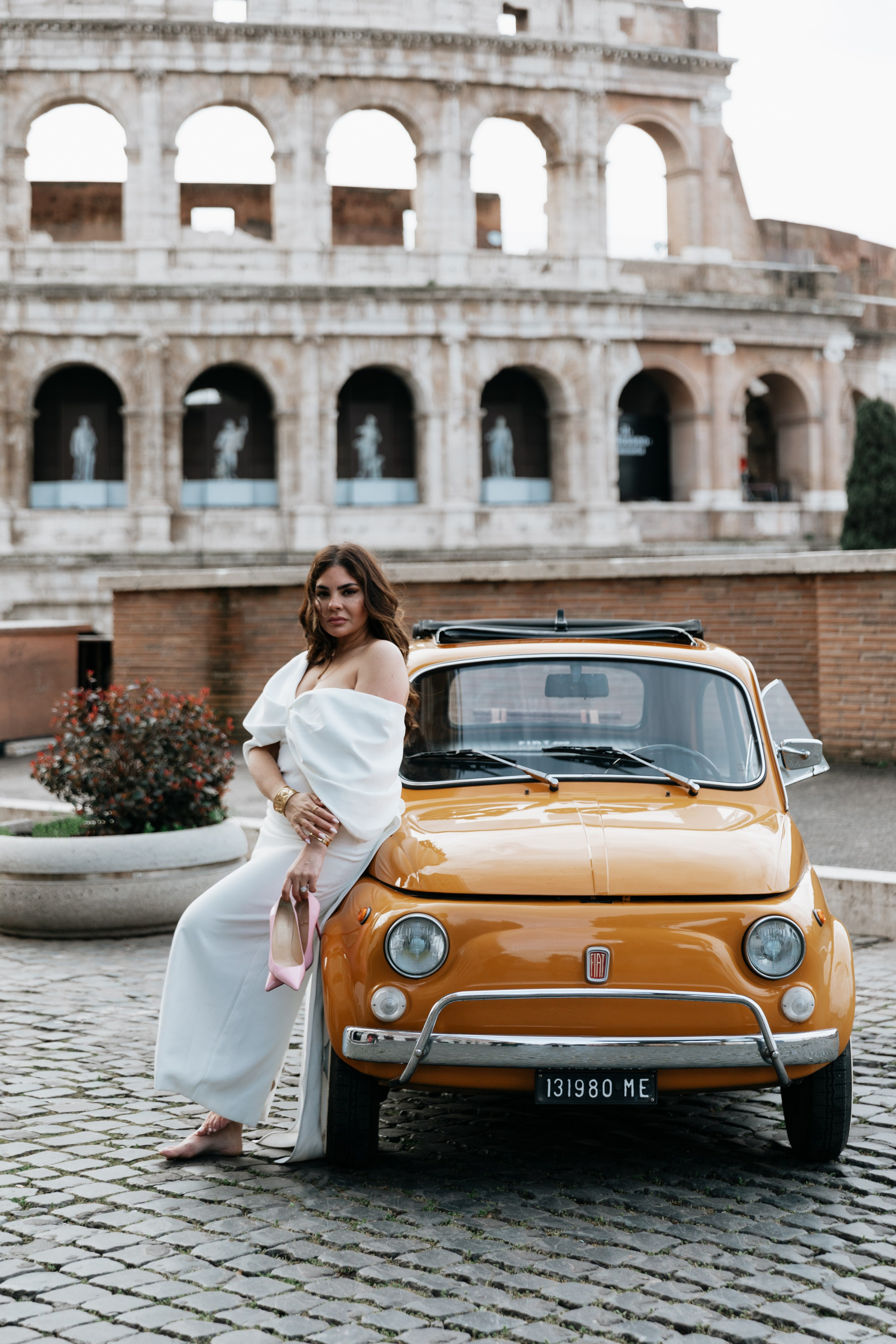 Fiat 500 and Vespa. Photographer in Rome